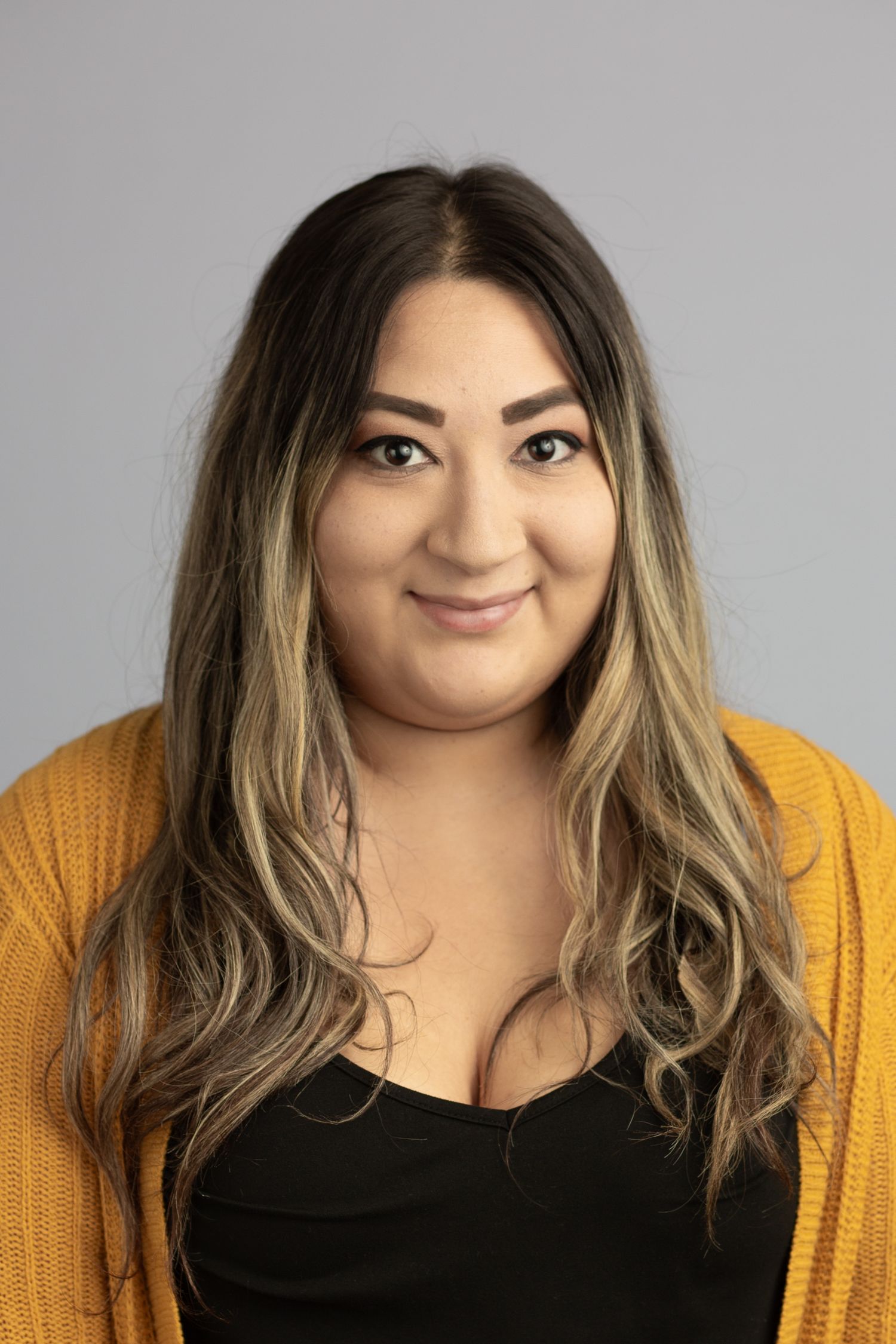 Headshot of a woman in a studio setting