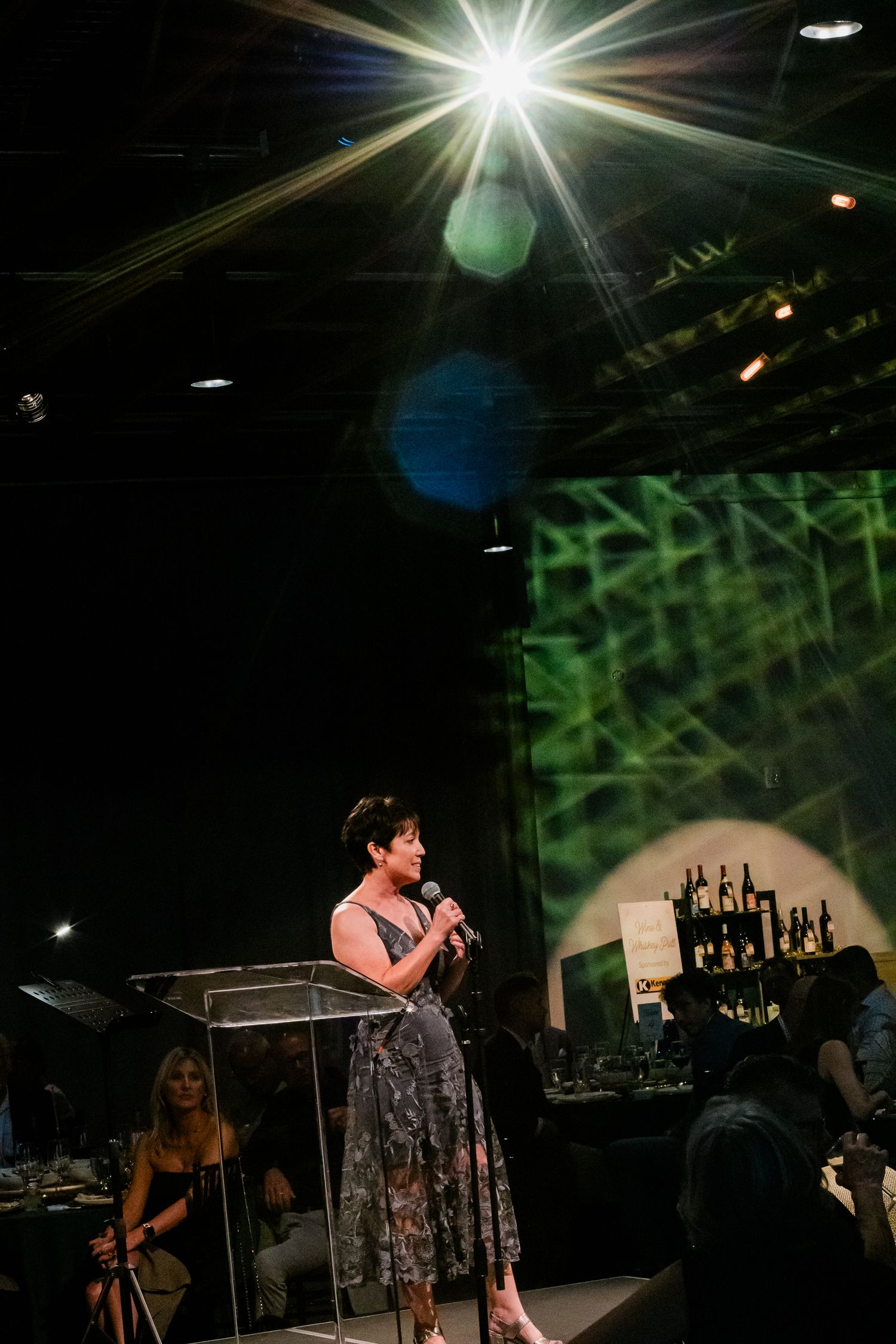 An emcee speaking at an event in Portland, Oregon