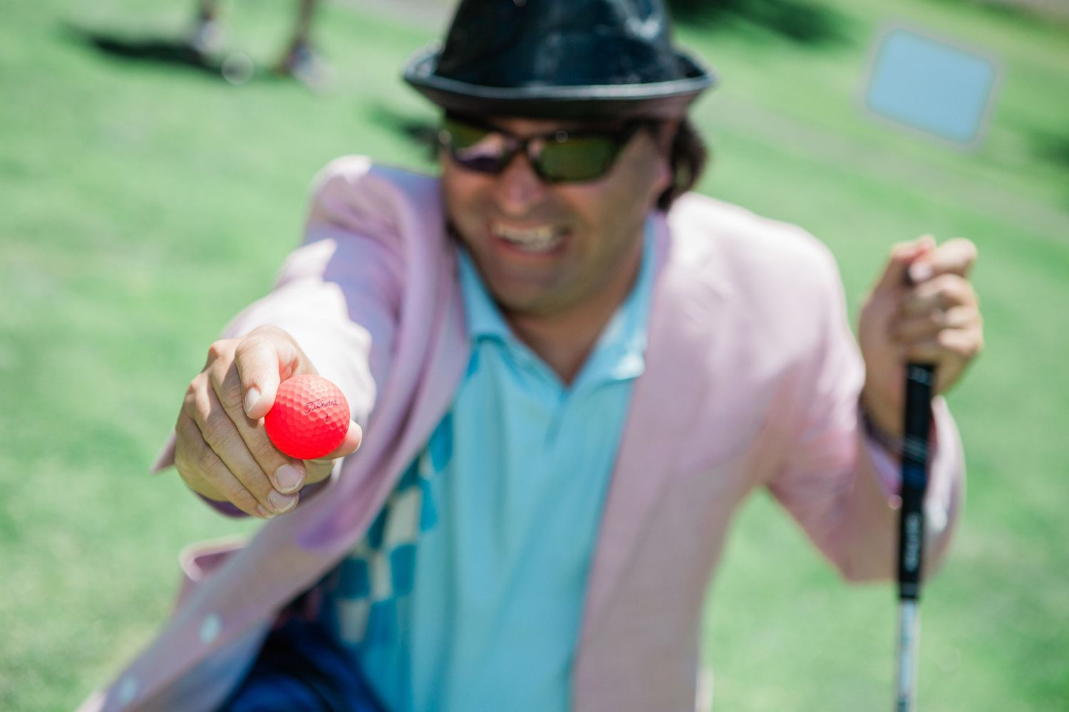 A man showing a golf ball