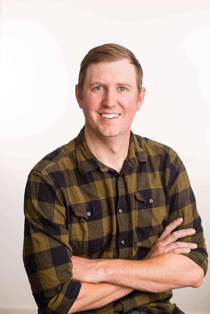 Headshot of a man in a studio setting