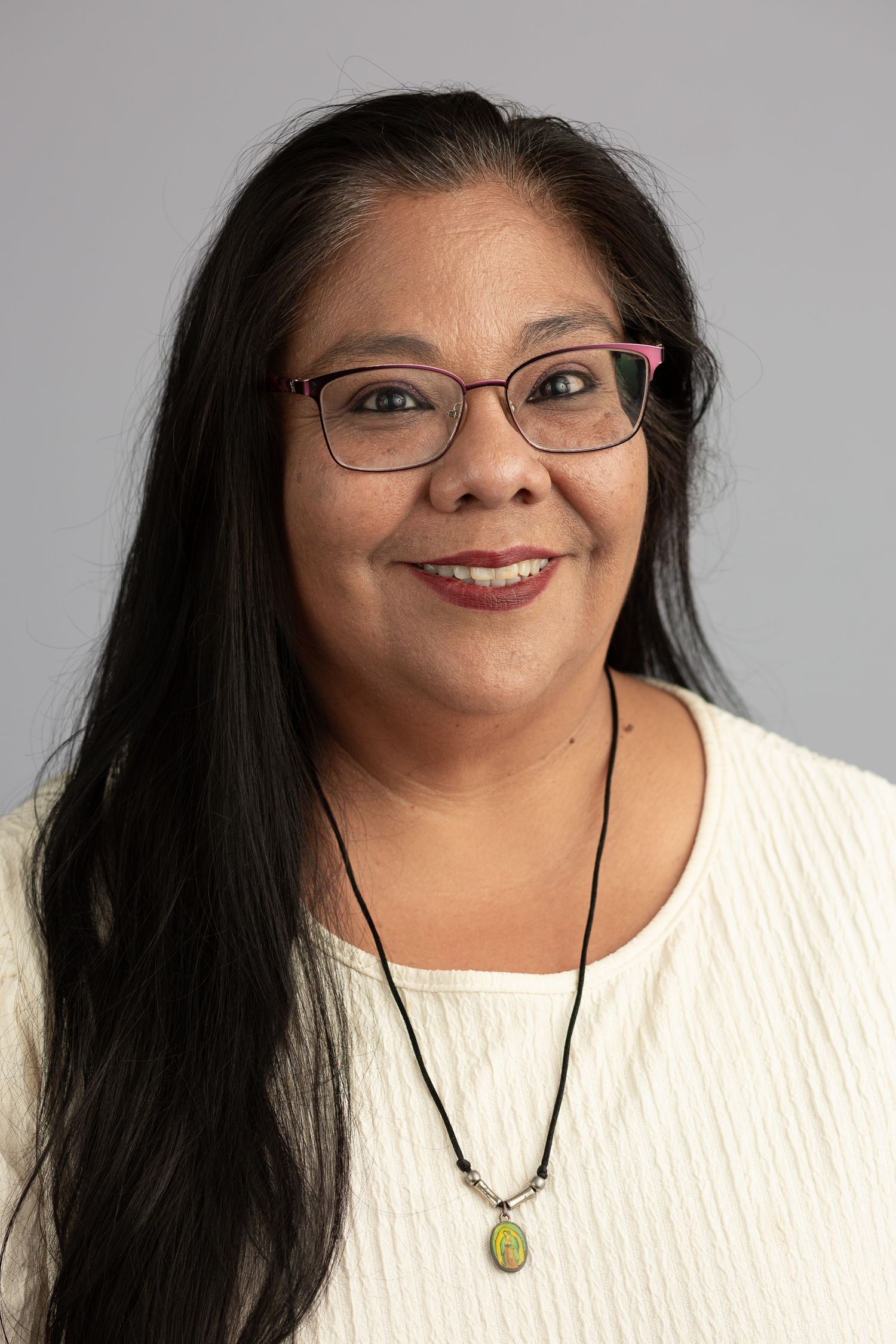 Headshot of a woman in a studio setting