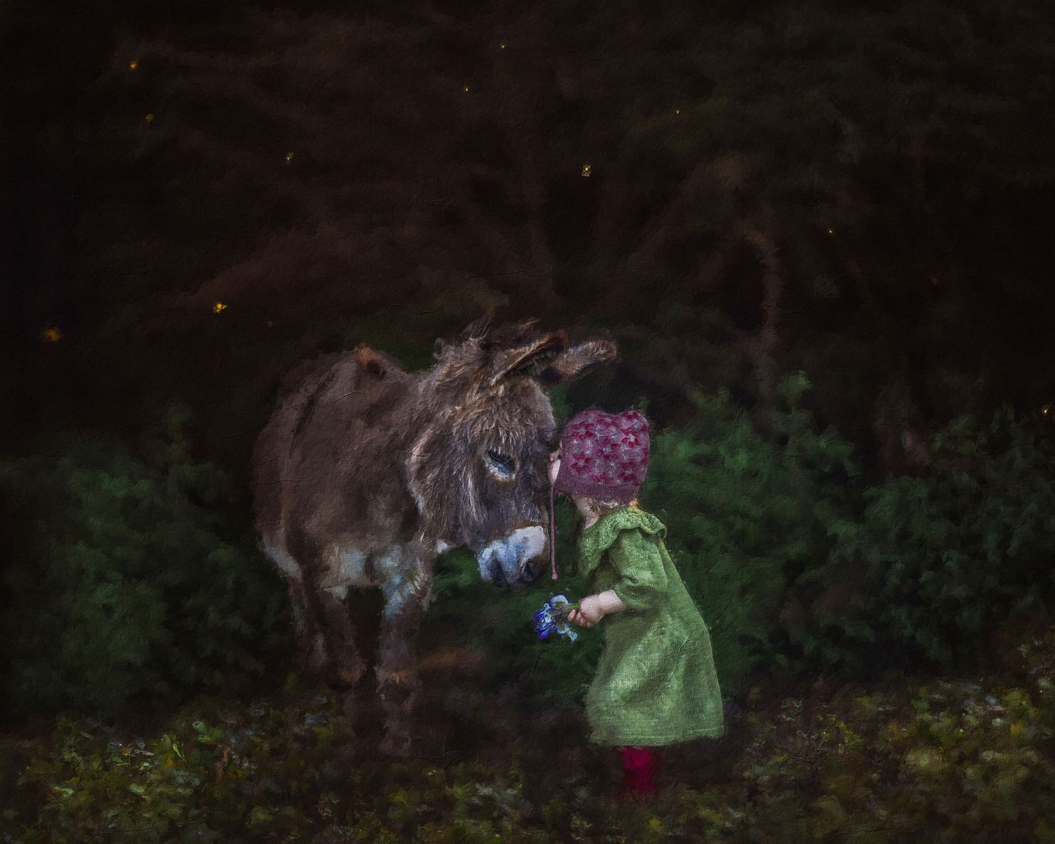 Horses in a dimly lit field at night with colorful accessories visible.