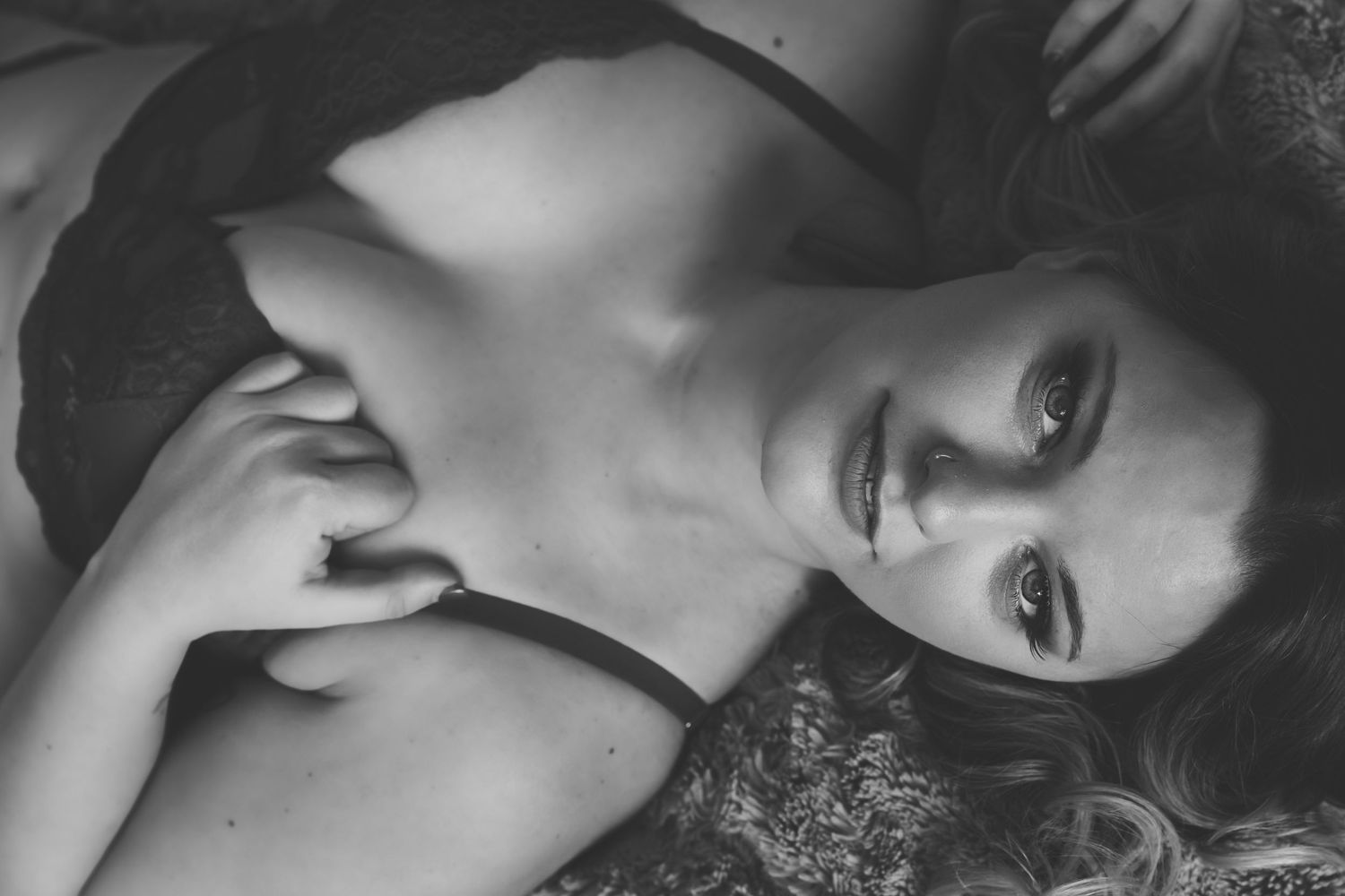 Classic black and white glamour portraits with dramatic lighting and poses.