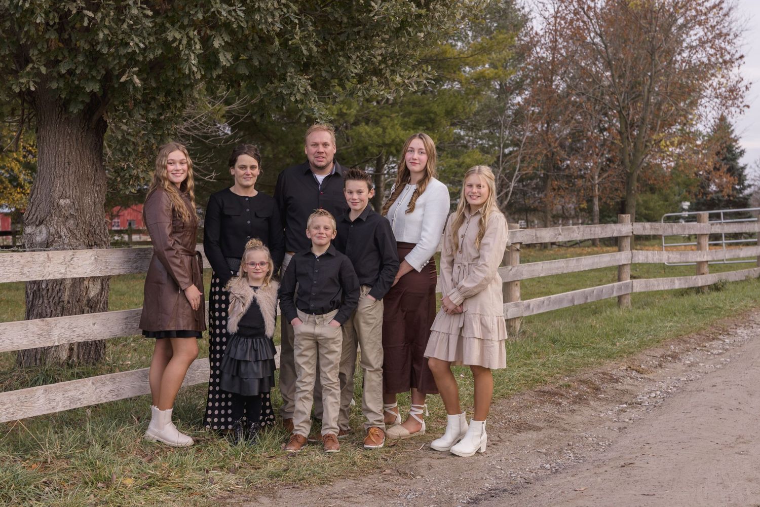 Group photo session outdoors on a path during autumn season.