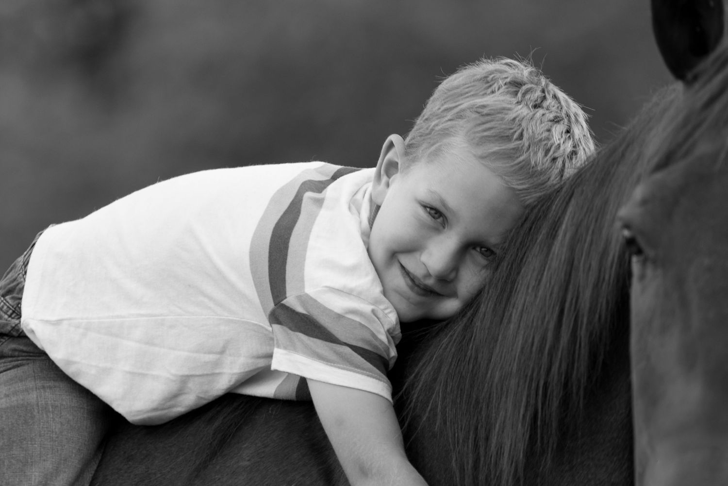 Black and white portrait series showing tender moments between parent and child.