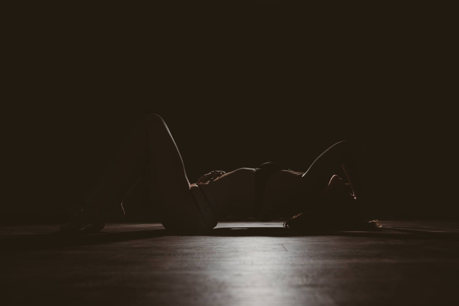 Dramatic low-light photography sequence showing silhouettes against a dark background.