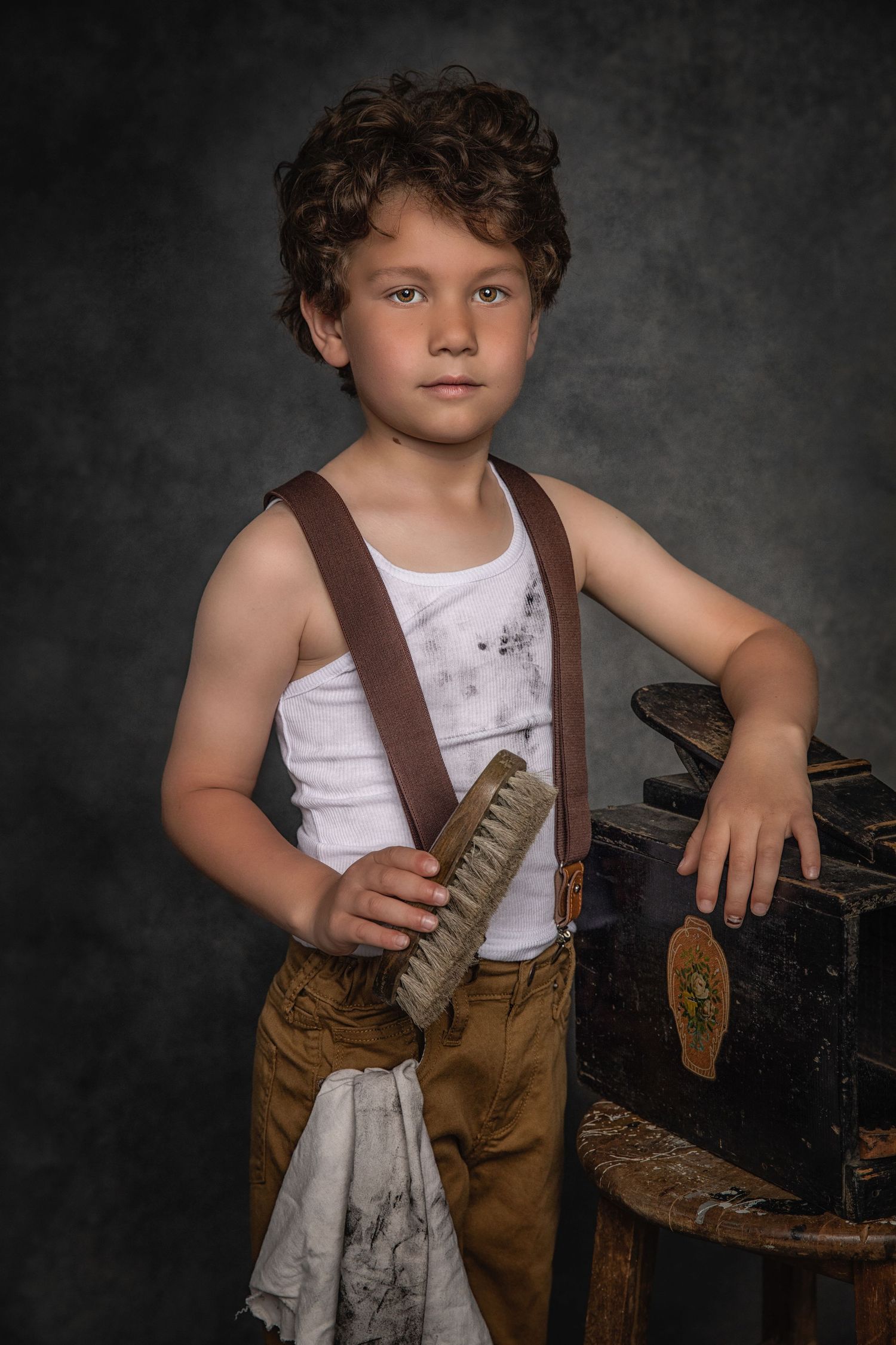 Vintage-style portrait of a figure in workwear with suspenders and cleaning supplies.