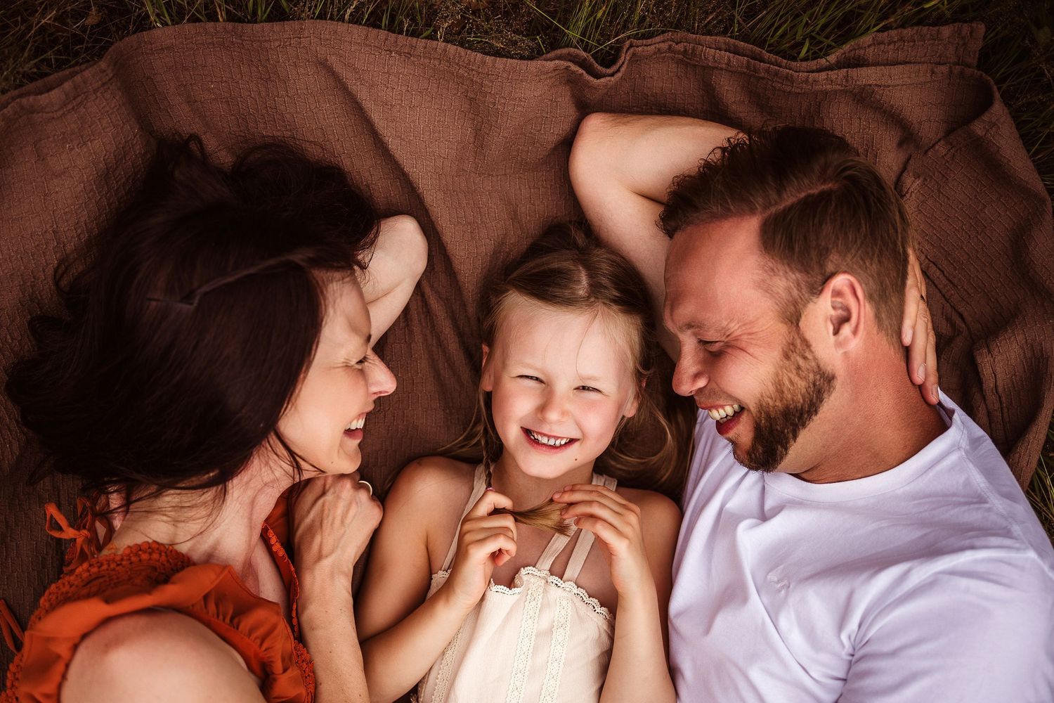 Intimate lifestyle photography session with warm tones and natural lighting.