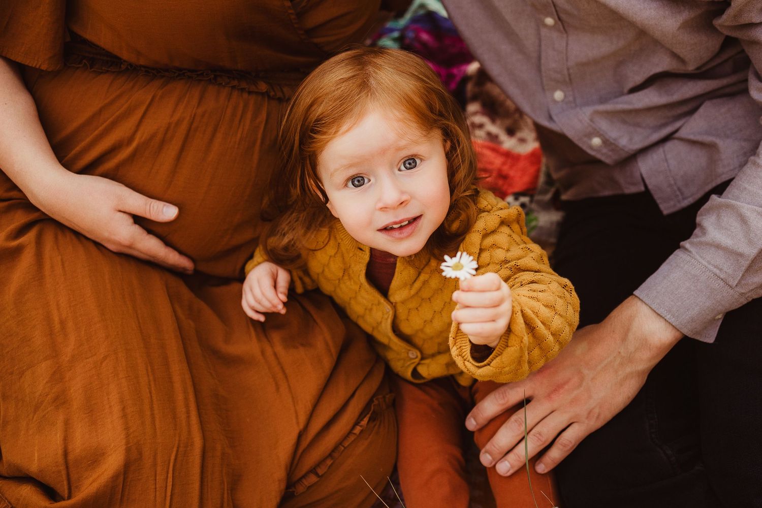 Candid family moments captured in warm indoor lighting.