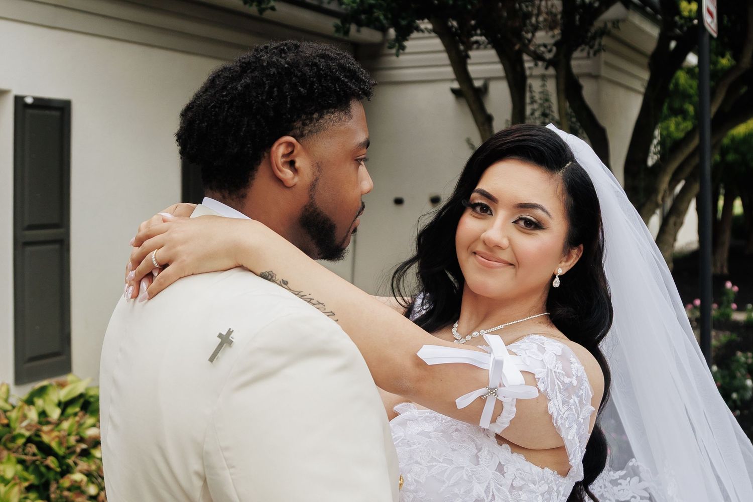 Romantic moments captured during outdoor wedding photography session.