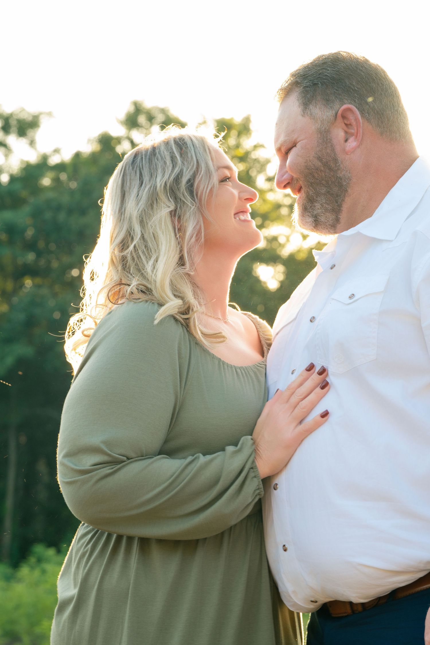 Romantic golden hour portrait session in a natural outdoor setting.