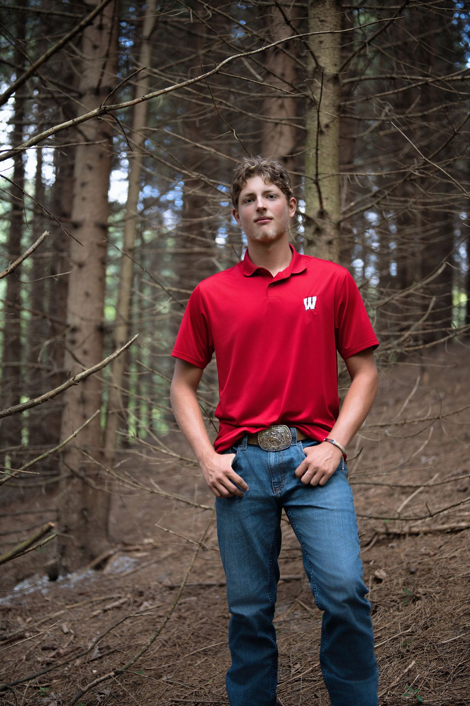 Portrait series taken in a pine forest with red clothing.