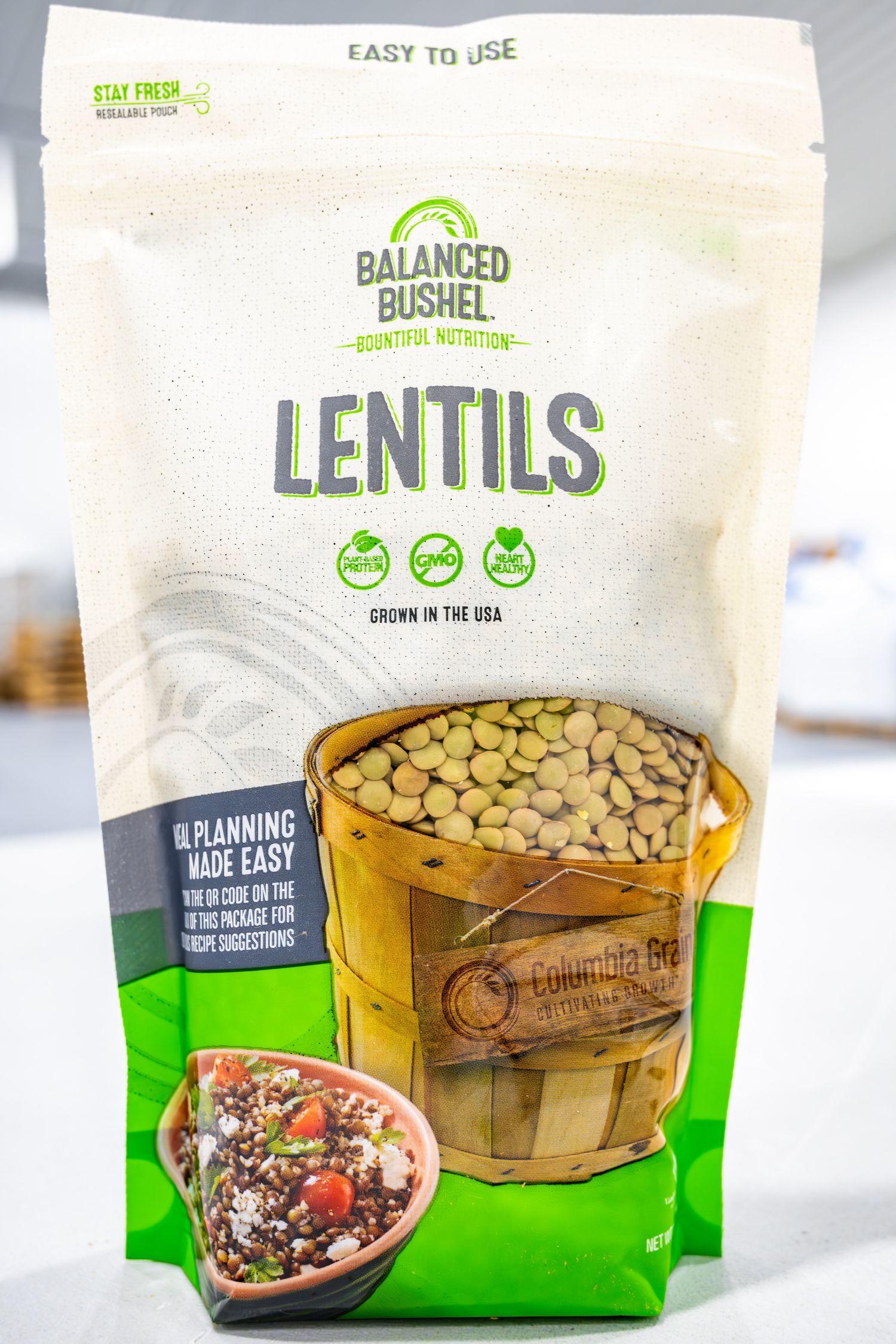 Package of Balanced Bushel brand lentils with product information and recipe photo on white background.