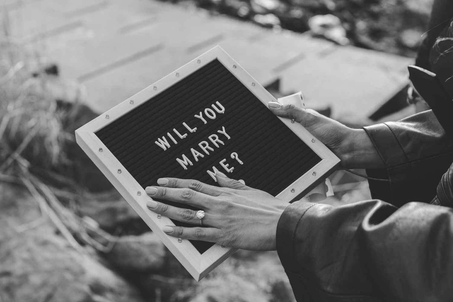 A woman holding a sign that says 