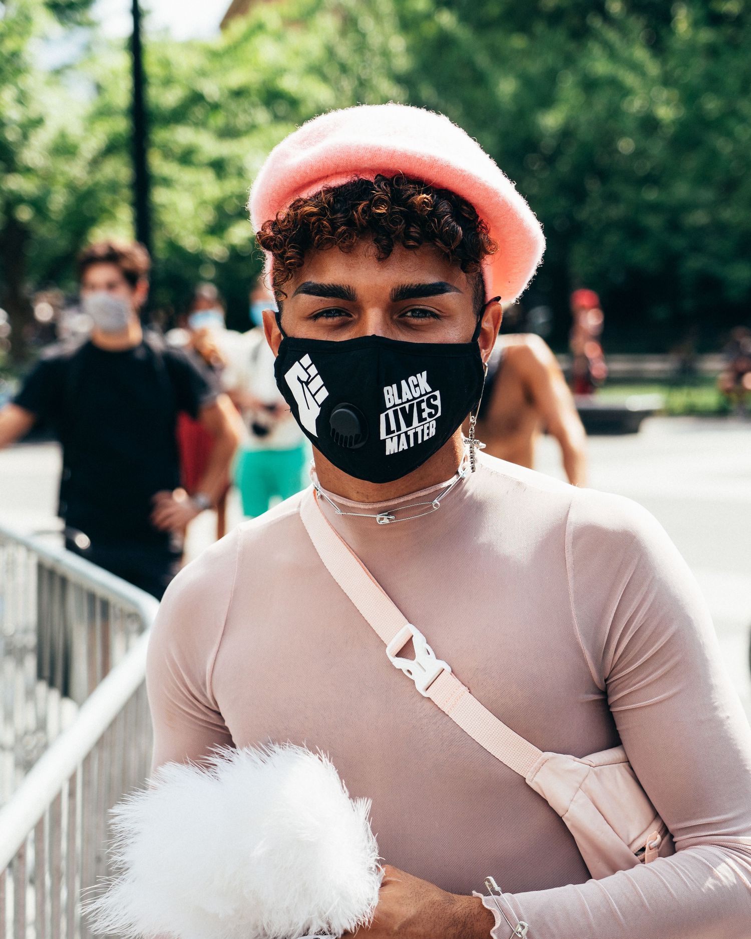 Young man in pink outfit support Black Lives Matter protest