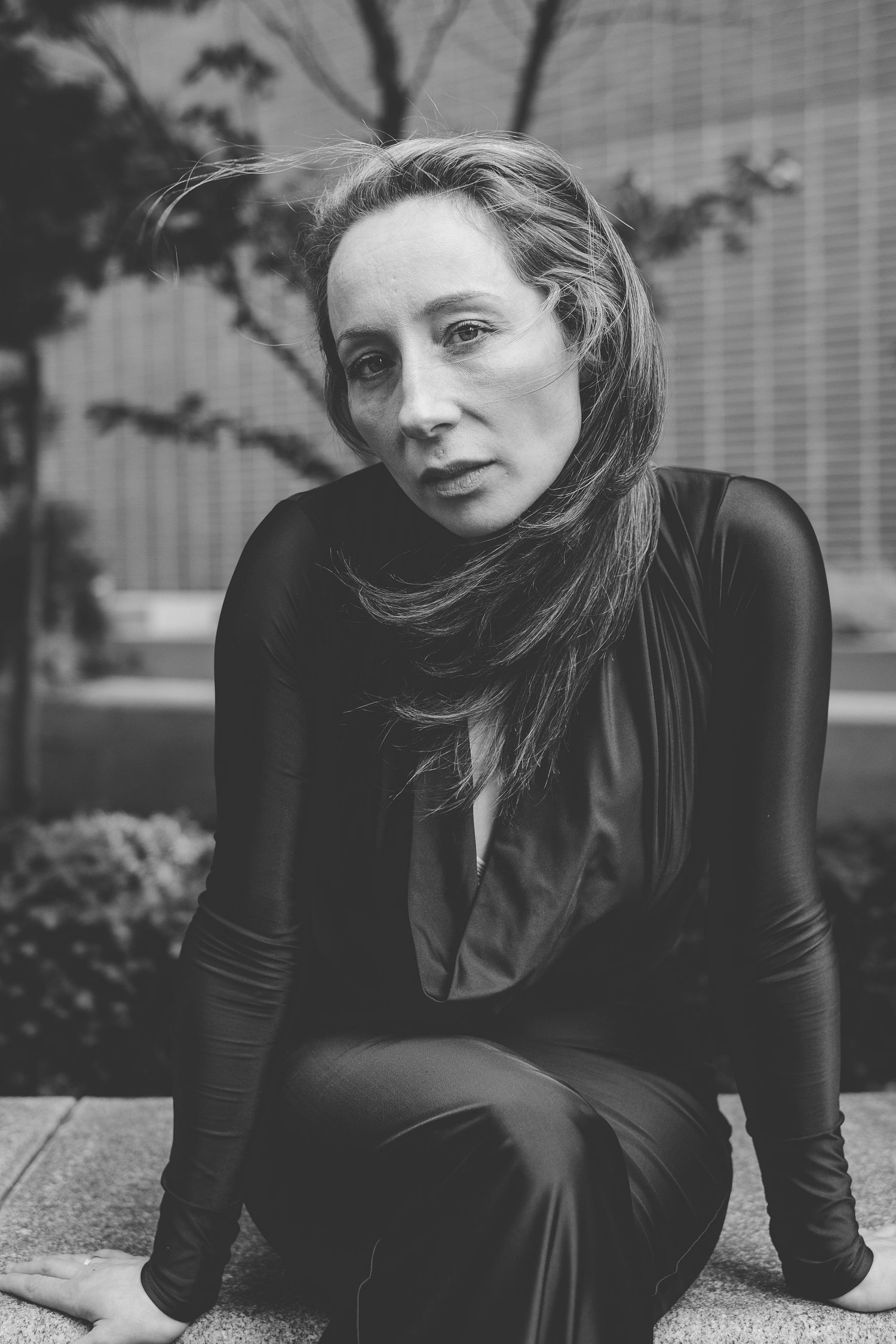 A woman in a slinky black dress
