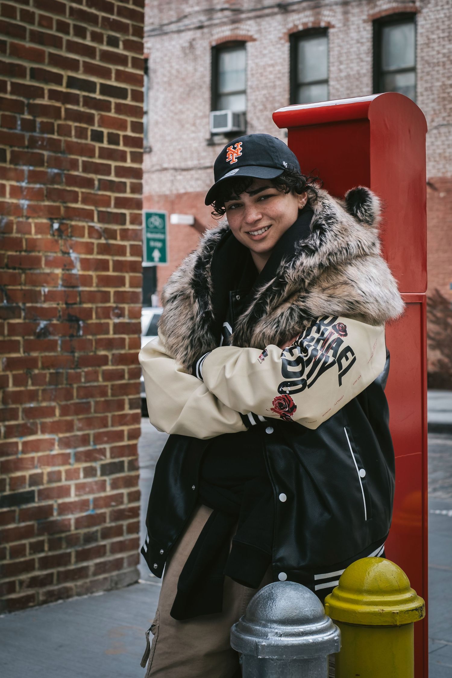 Woman posing on a fire hydrant in DUMBO, Brooklyn