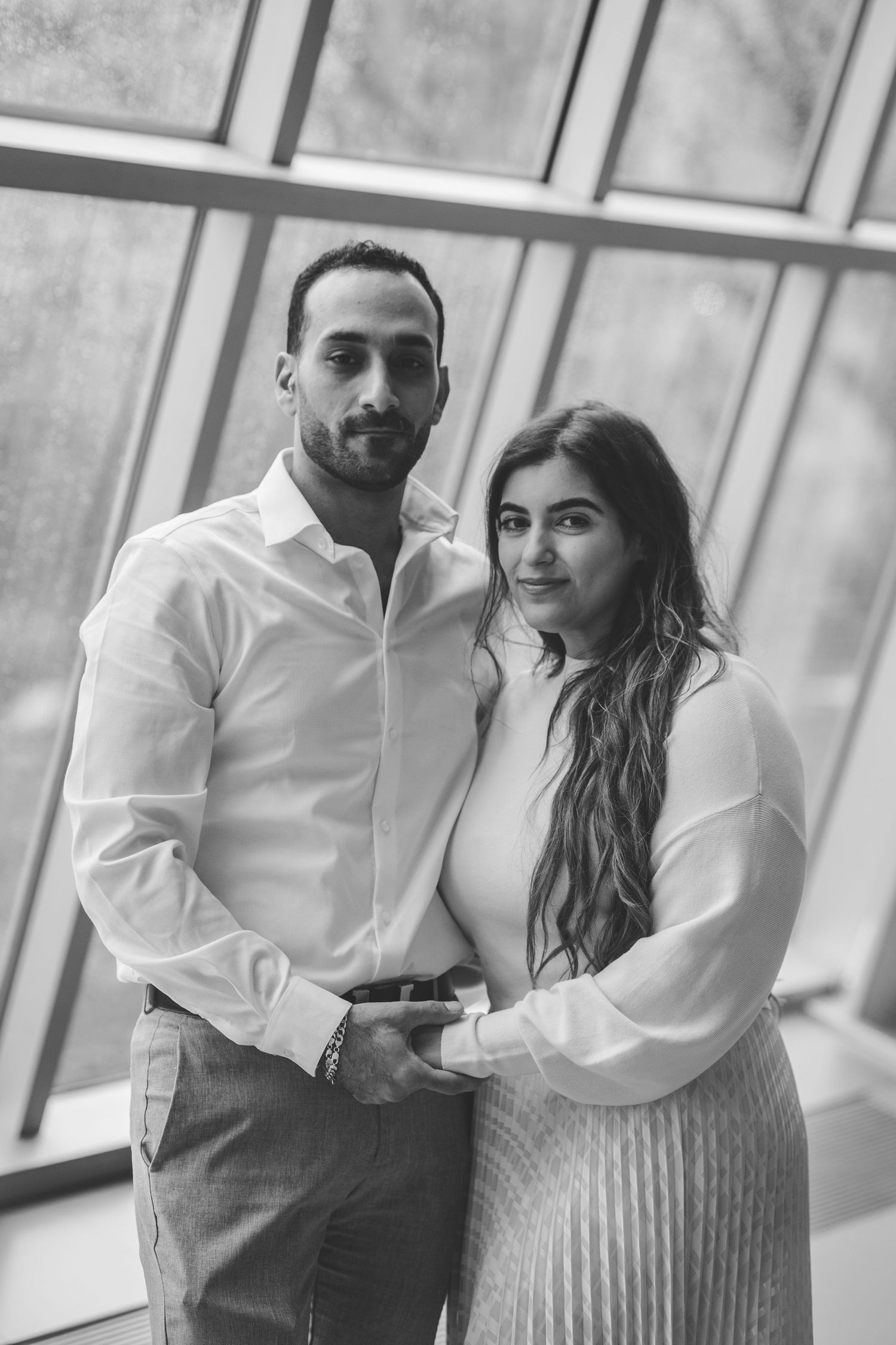Couple holding hands and posing together in the Egyptian exhibit of The Met Museum in New York City