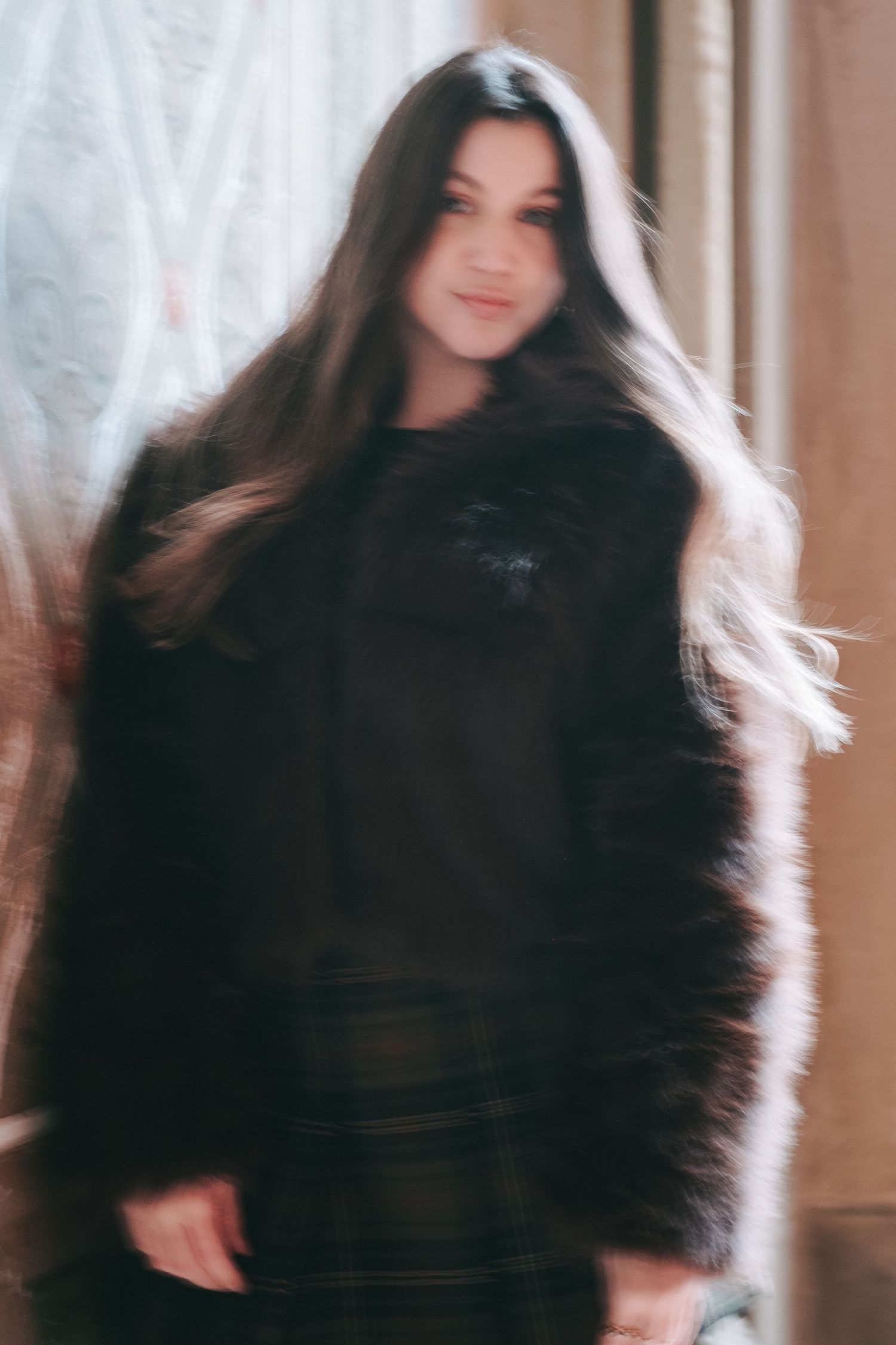 Blurred portrait of a woman in a fur jacket