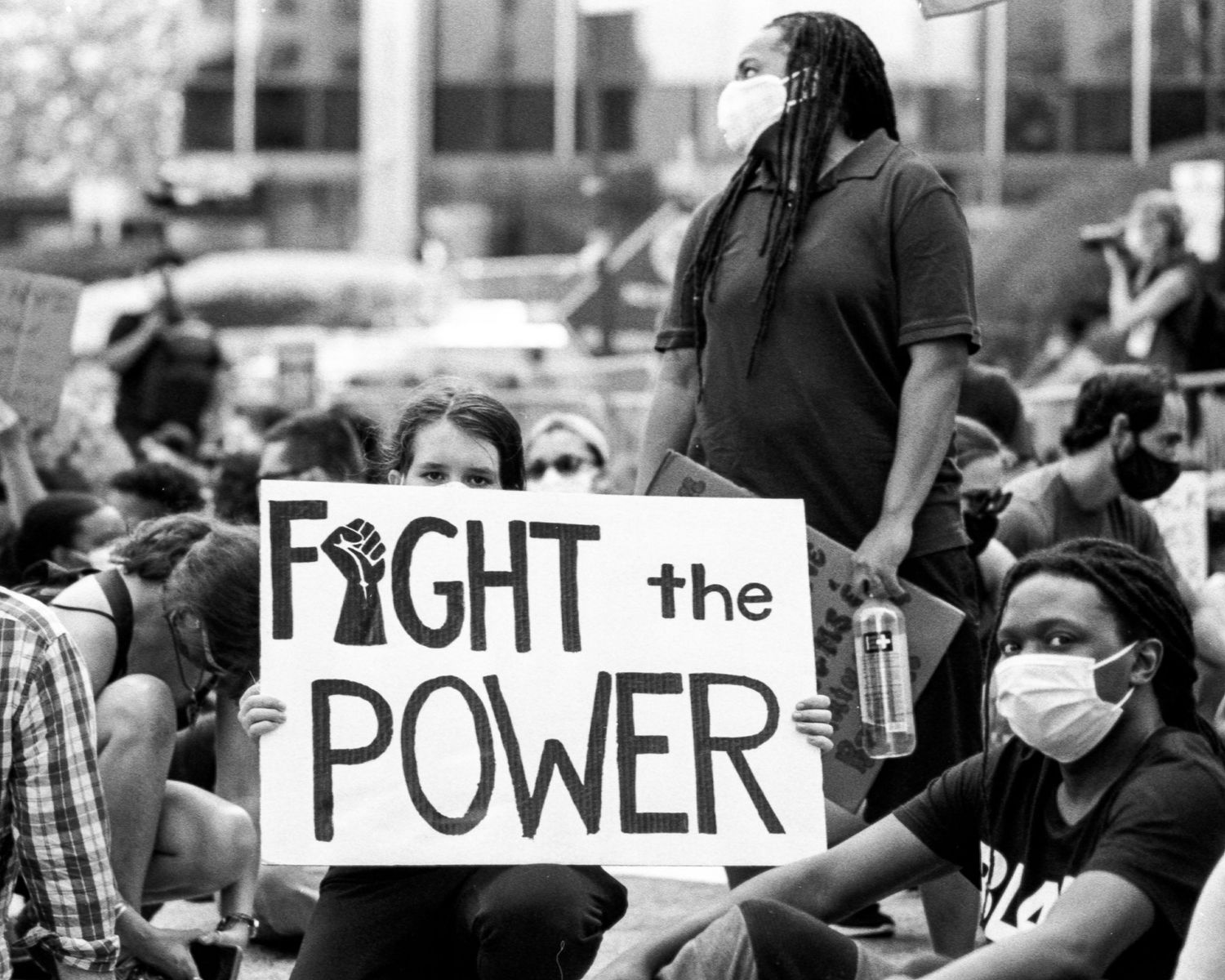 Sign reading Fight the Power at a protest against police brutality