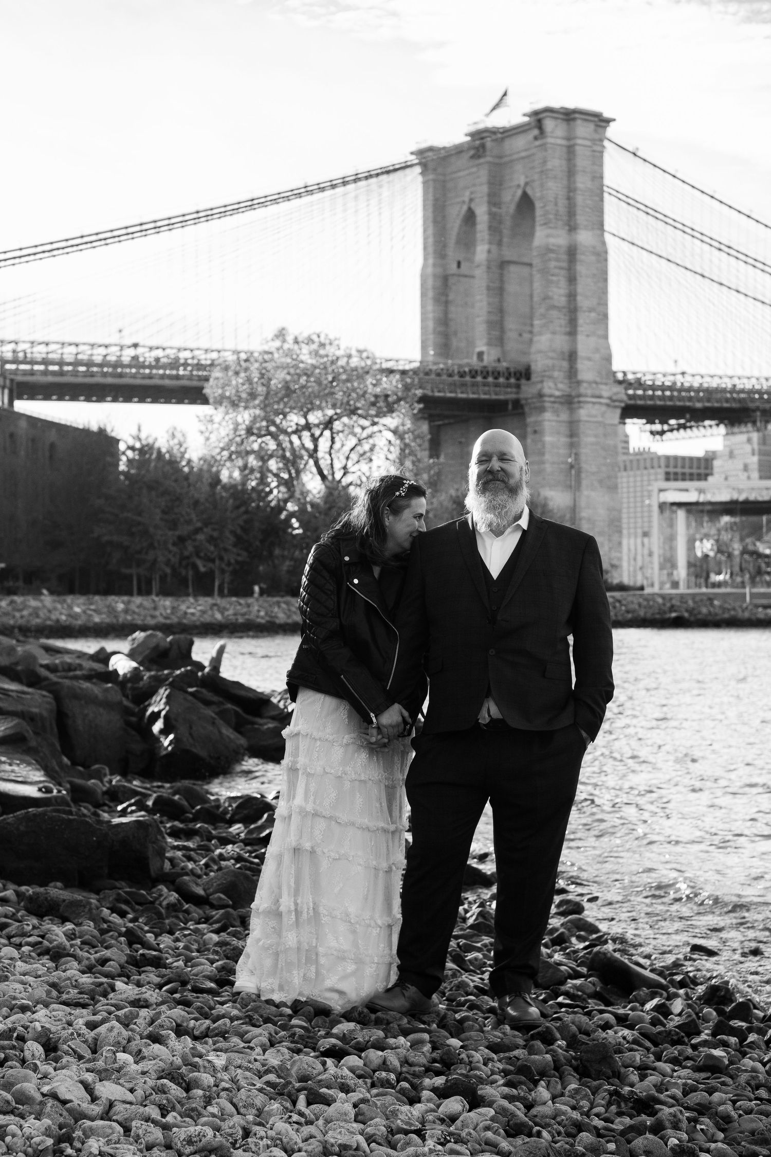 A couple standing on Pebble Beach in DUMBO, Brooklyn