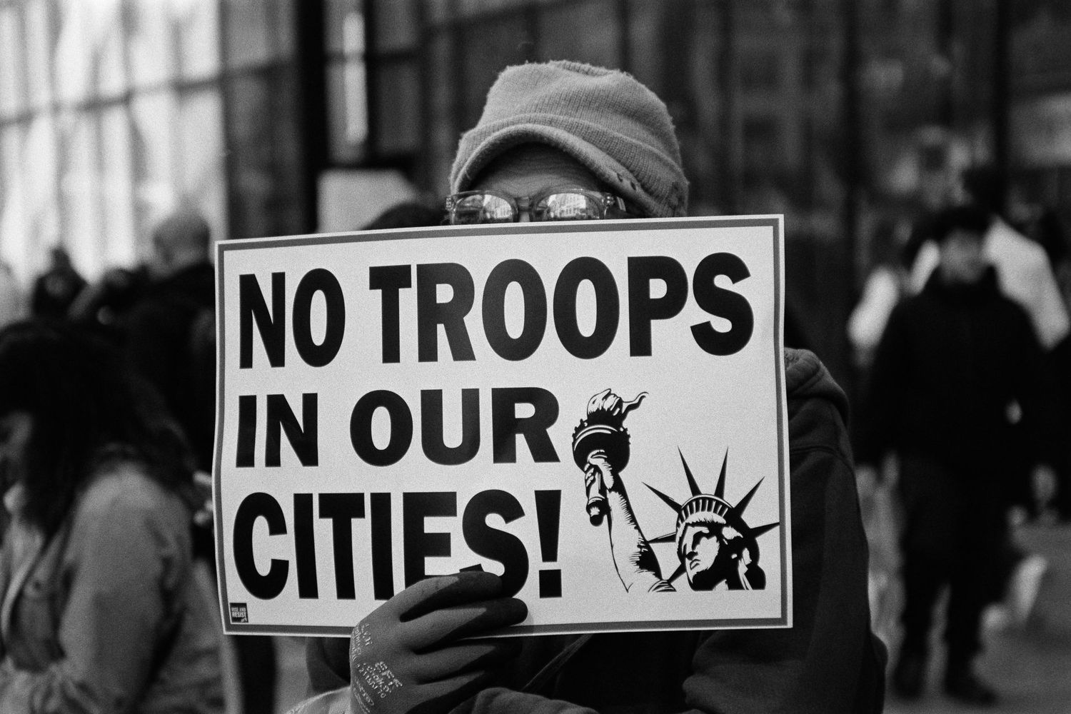 Activist protesting military presence in American cities