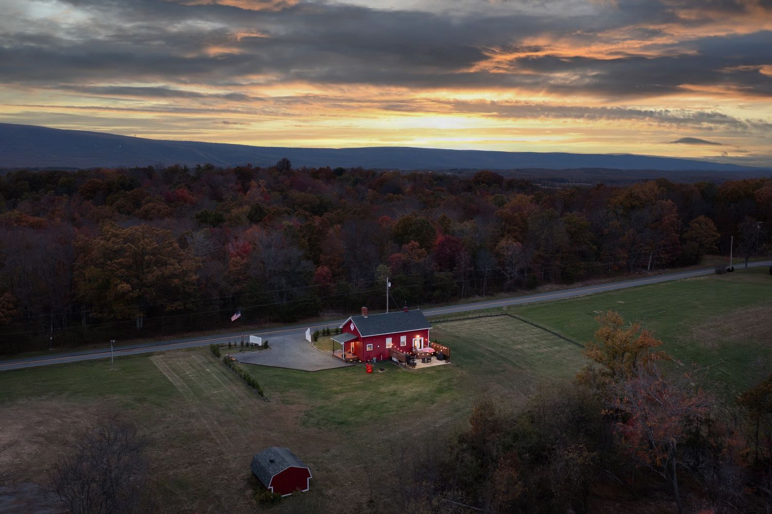 Cinematic drone footage for commercial real estate marketing. Twilight real estate photography capturing exterior home.