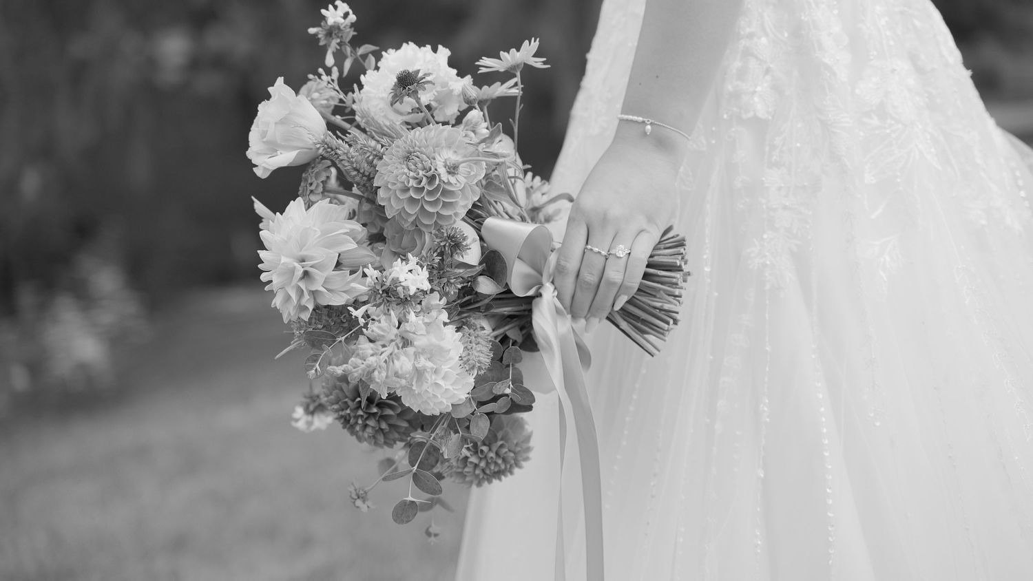 Bride holding an elegant floral bouquet during a Maryland wedding detail moment