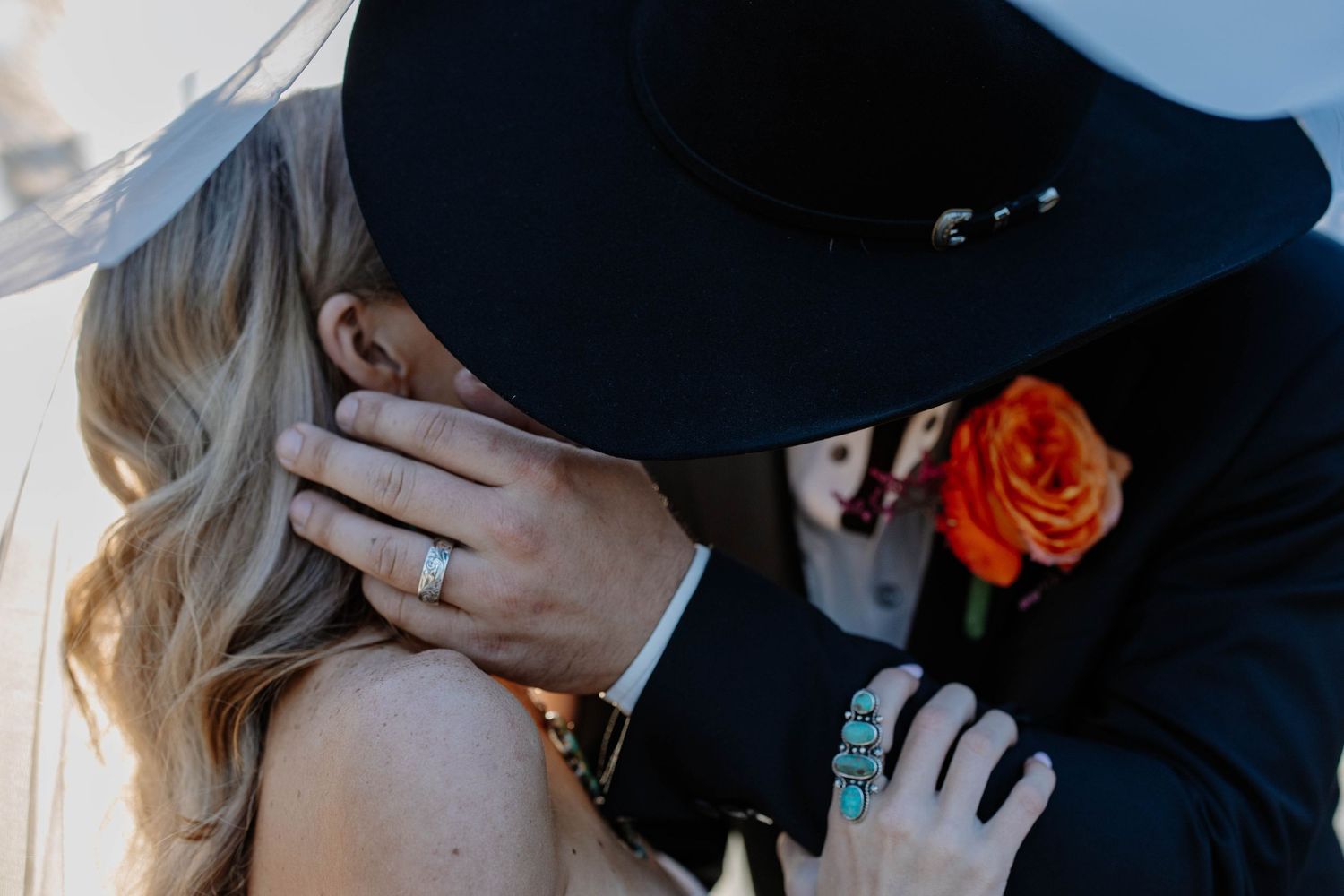 Intimate wedding couple moment captured in soft natural light.