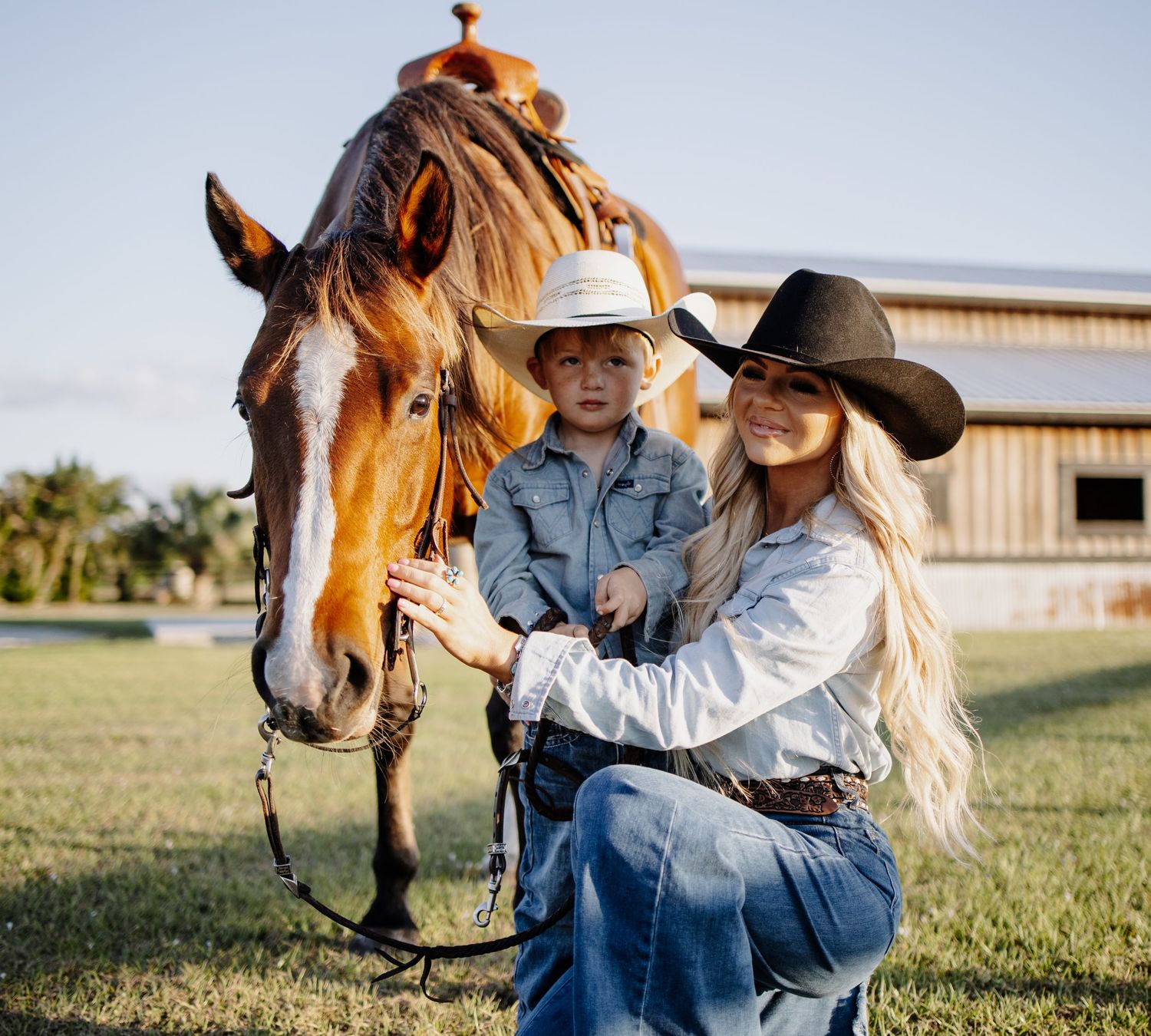 Equestrian lifestyle shoot with brown horse in outdoor ranch setting.