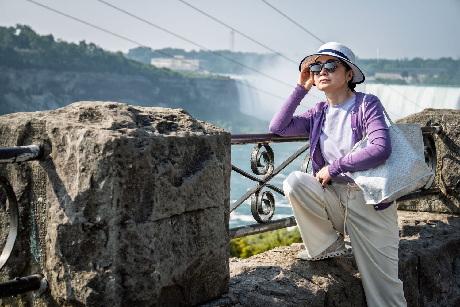 street portrait of a person waiting for their people on the zipline