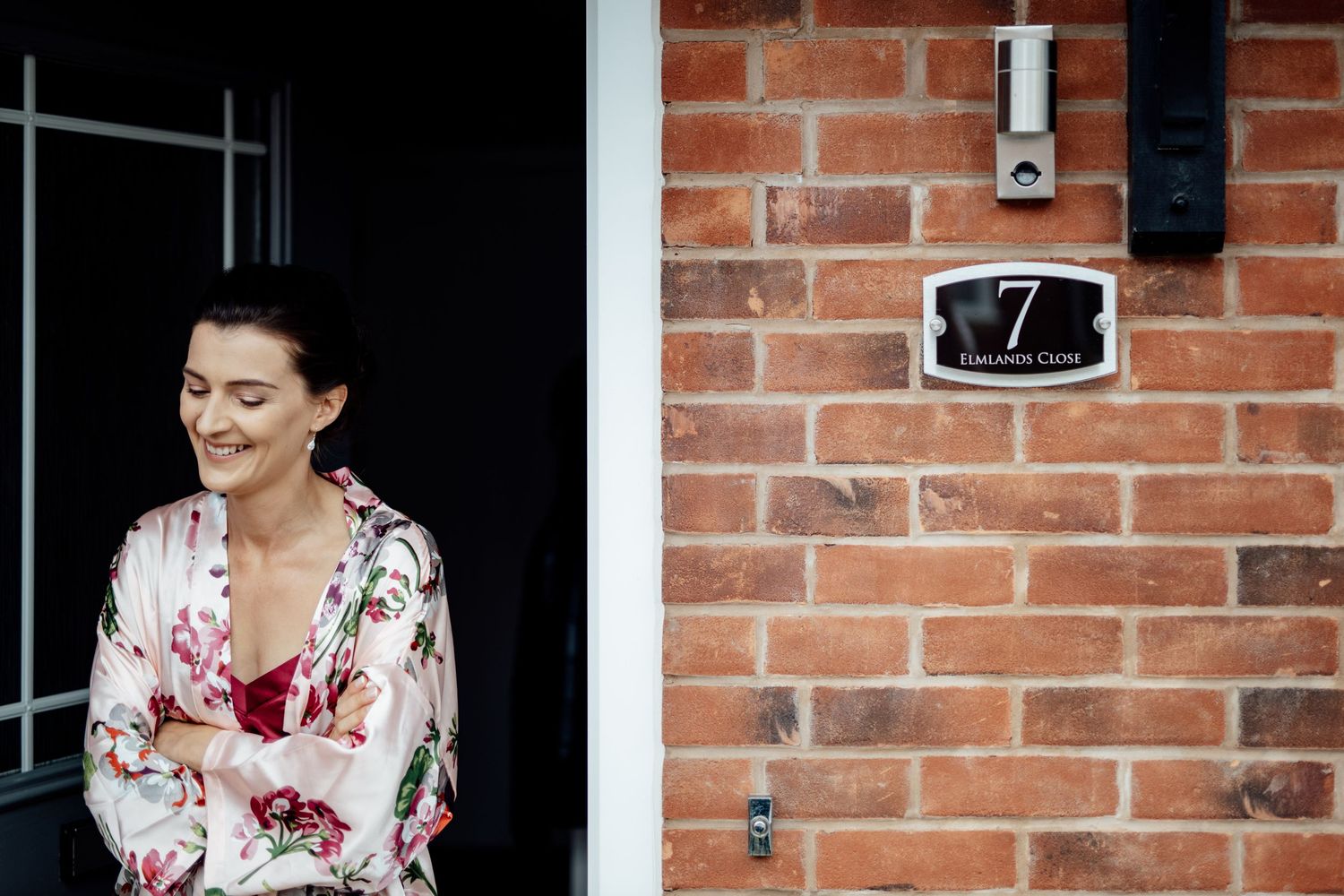 Elegant bridal preparations at a brick building with classic house number seven.