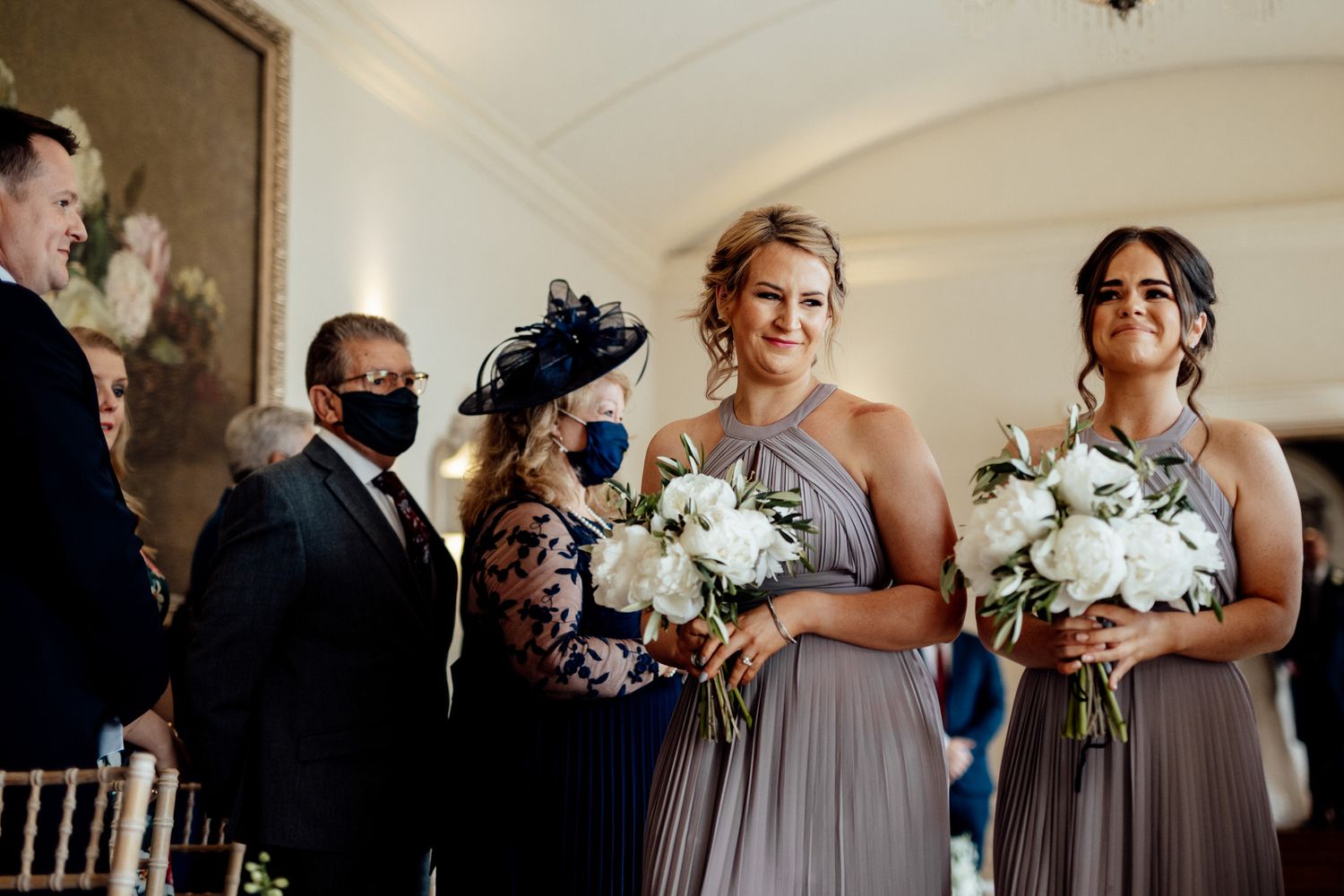bridesmaids walking dow the isle