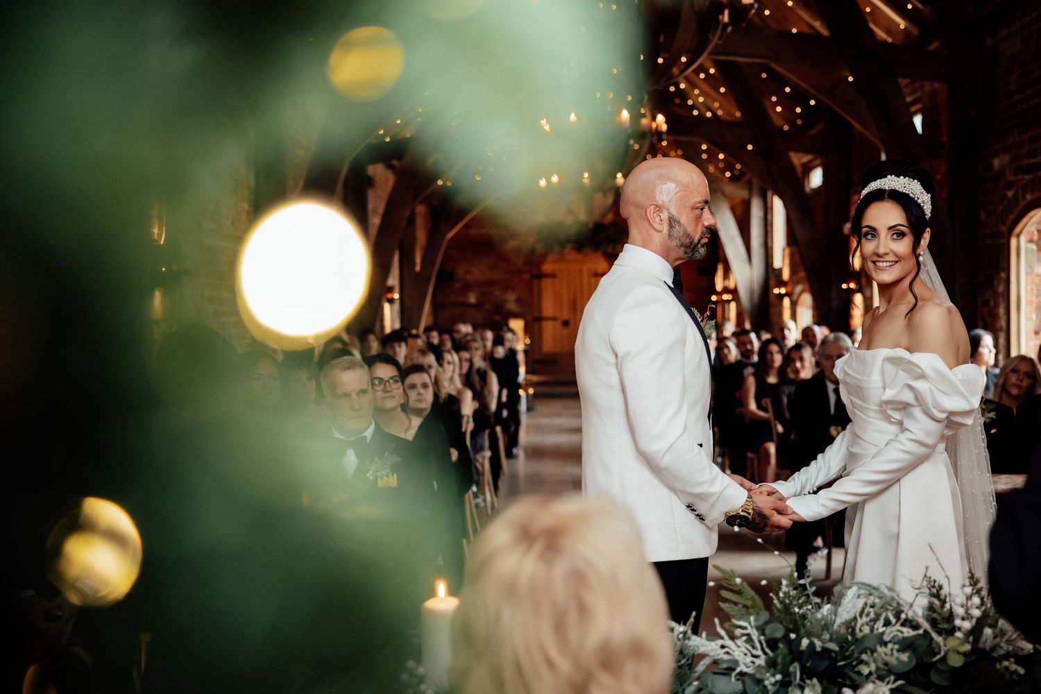 Wedding reception dance with bokeh lights creating a magical atmosphere.