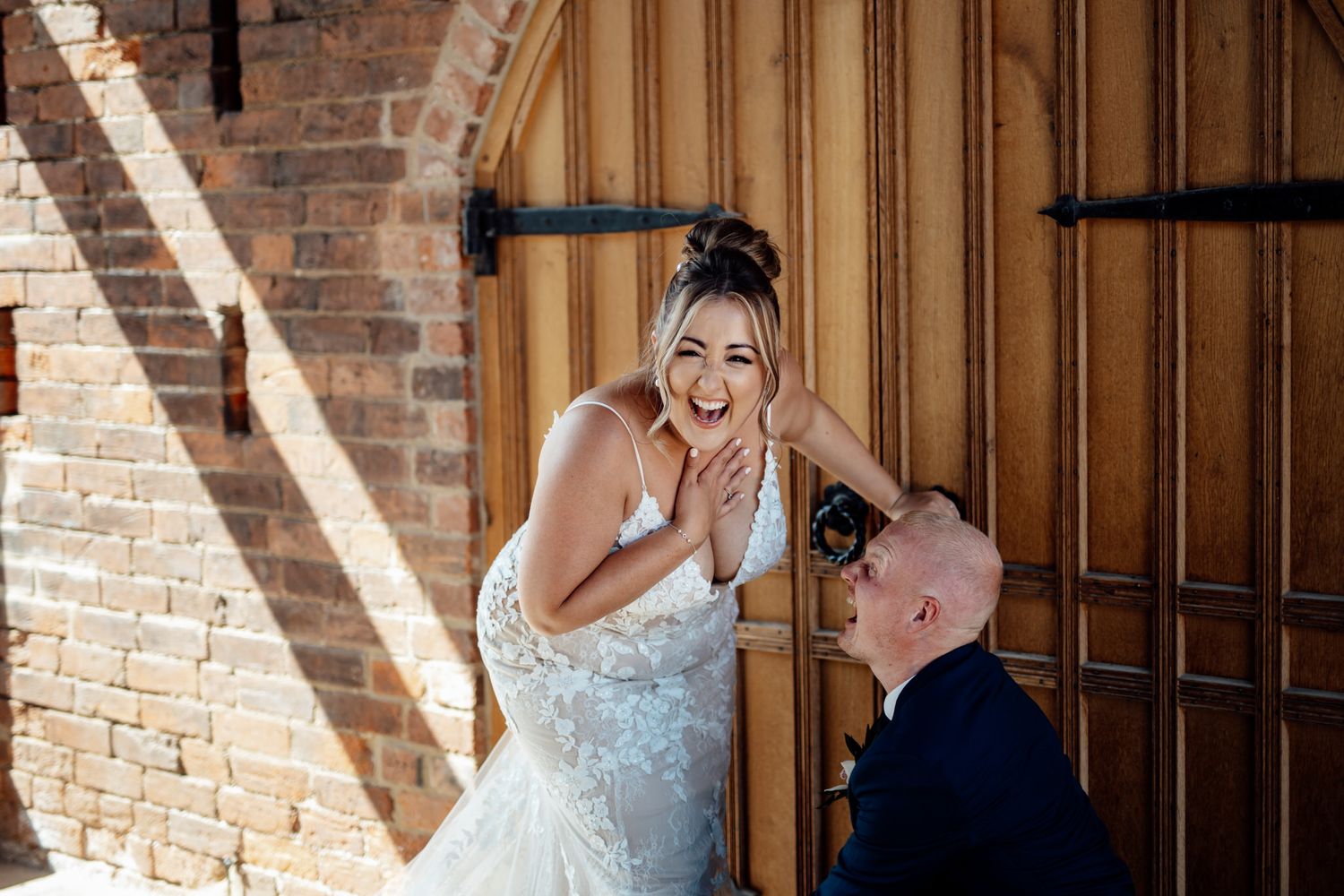 Natural light streams through windows onto brick walls in wedding venue.