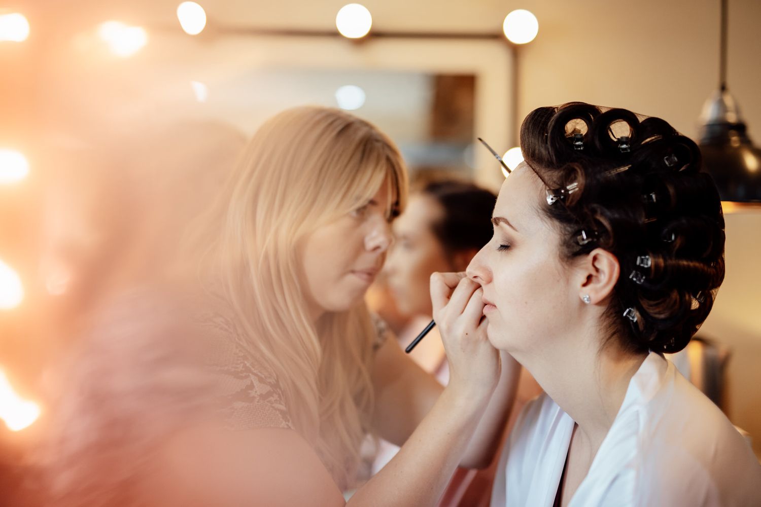 Wedding preparation scene with bokeh lights creating dreamy atmosphere.