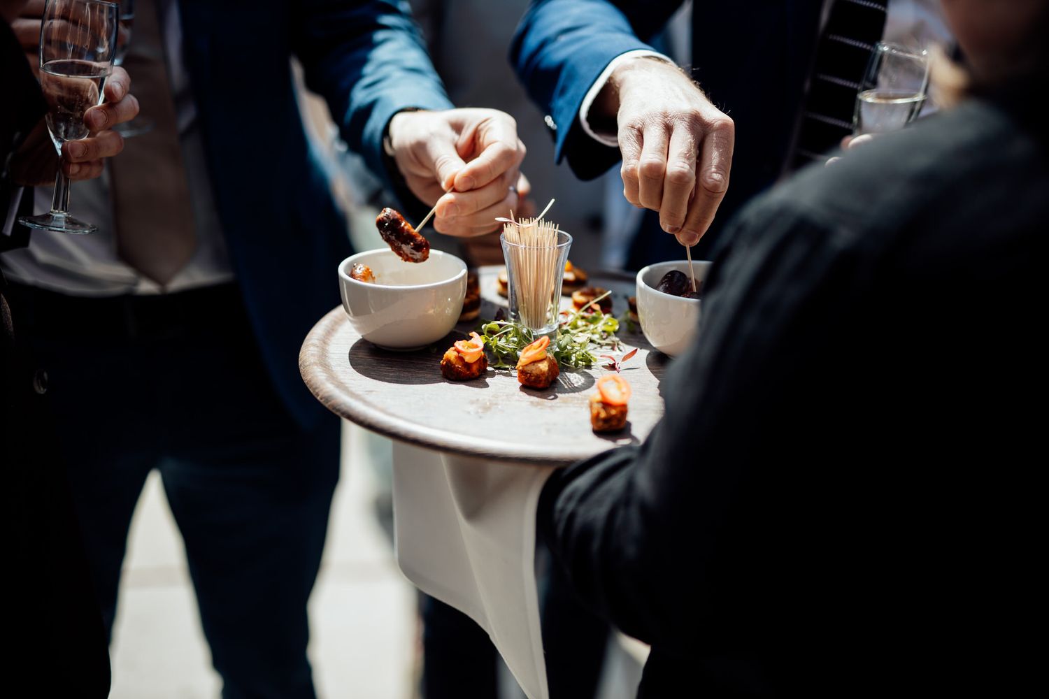 Wedding guests enjoying appetizers at cocktail reception.