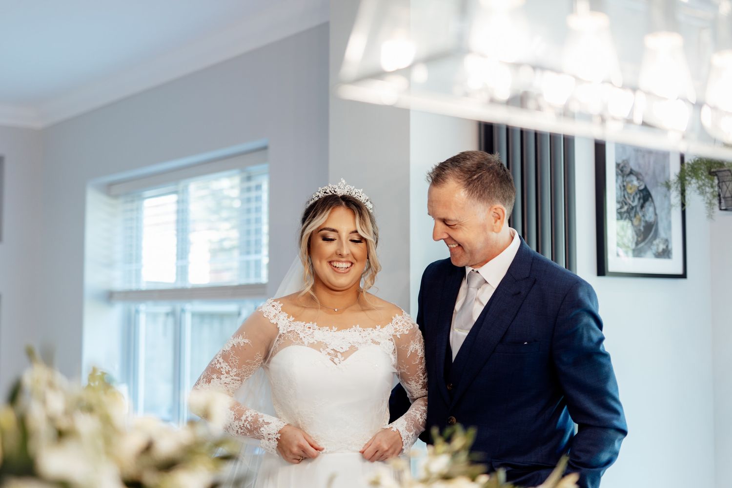 Bright indoor wedding preparation scenes with natural window lighting.