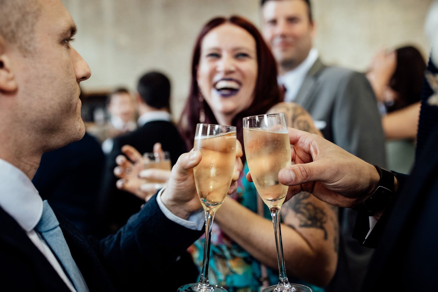 Wedding guests mingling and enjoying drinks during cocktail hour.