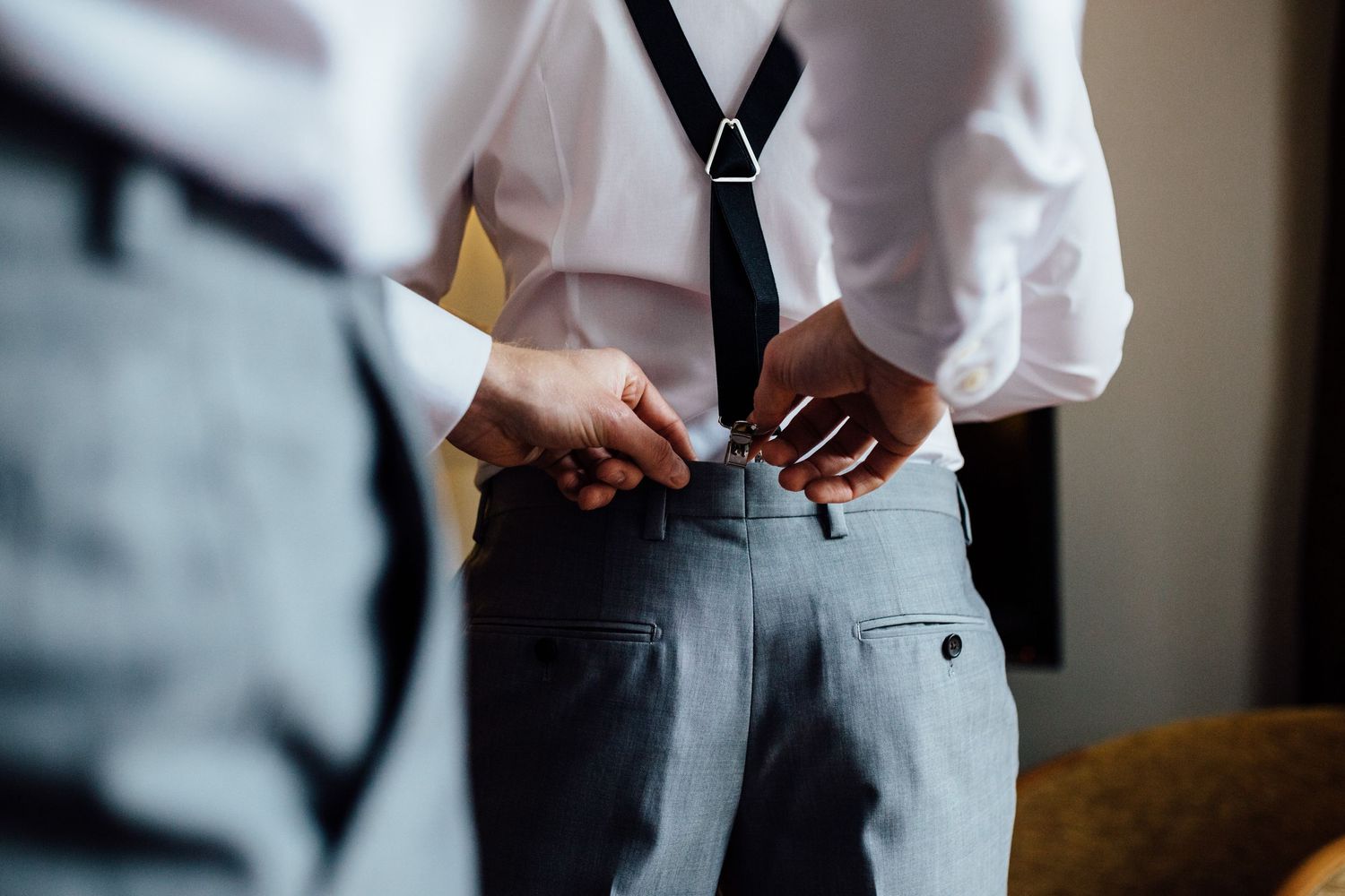 Wedding party members in formal attire preparing for ceremony.