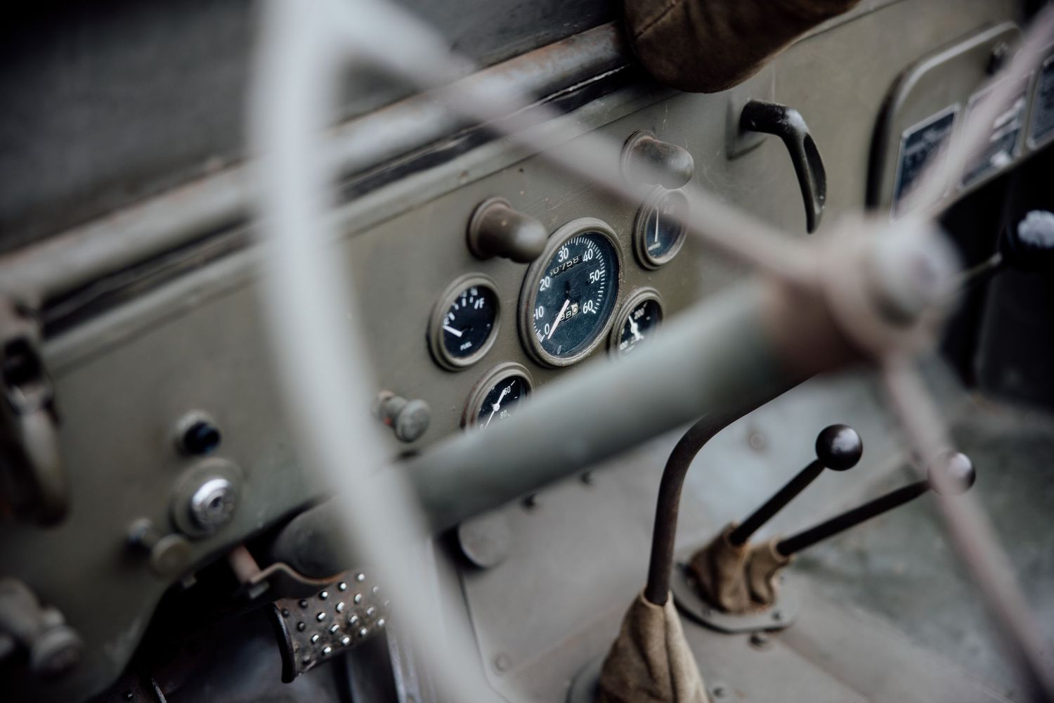 Close-up details of vintage car gauges and dashboard instruments.
