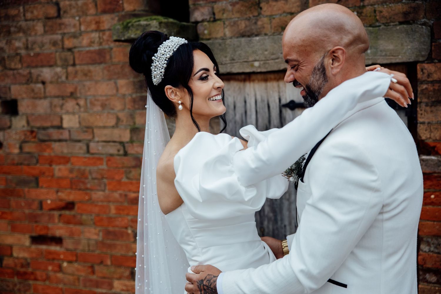 Couple sharing an intimate dance moment at their wedding reception.
