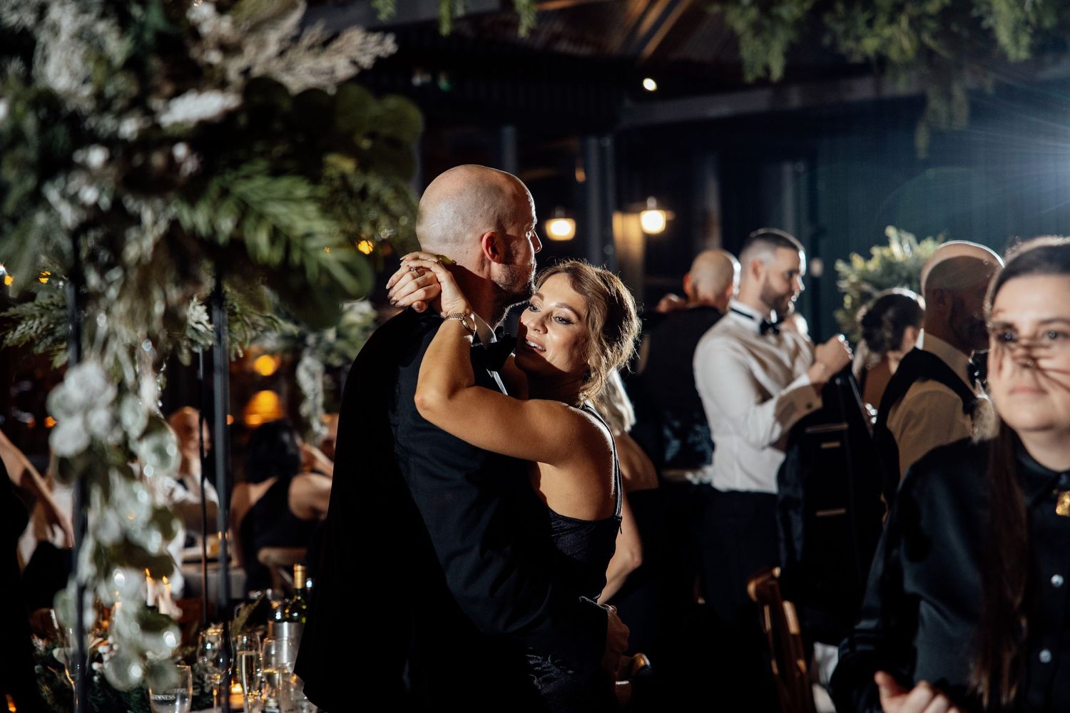 Wedding reception entertainment with performers engaging the crowd in an elegant venue.