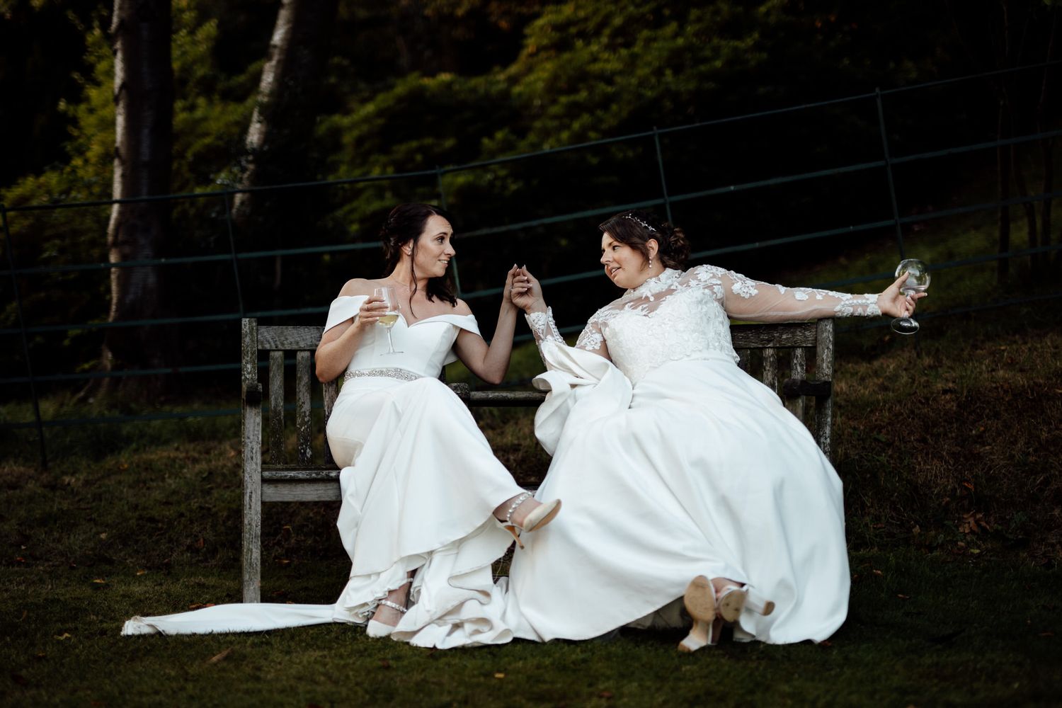 Wedding photo session on grassy hillside at sunset.