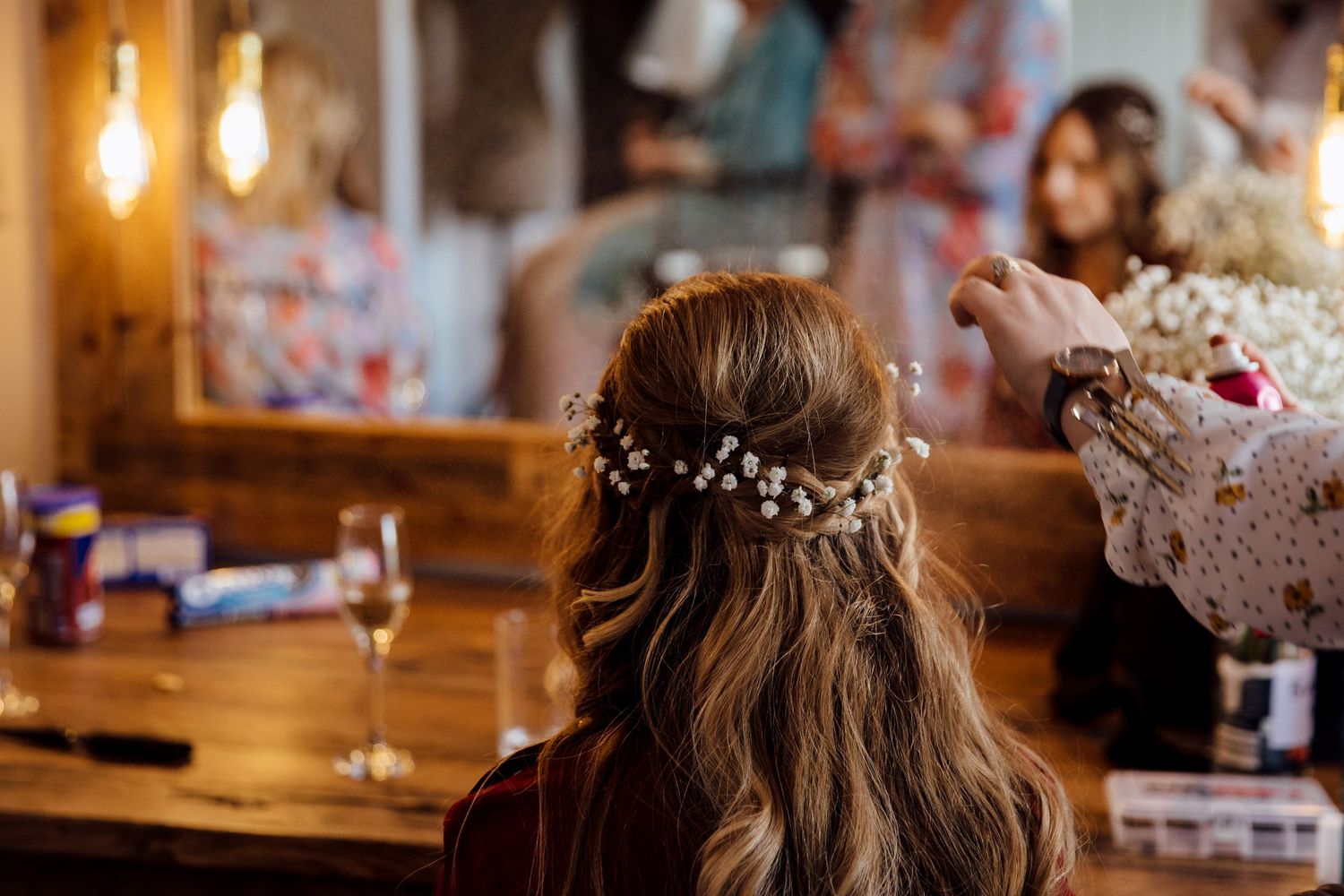Wedding reception venue with warm ambient lighting and rustic wooden decor.
