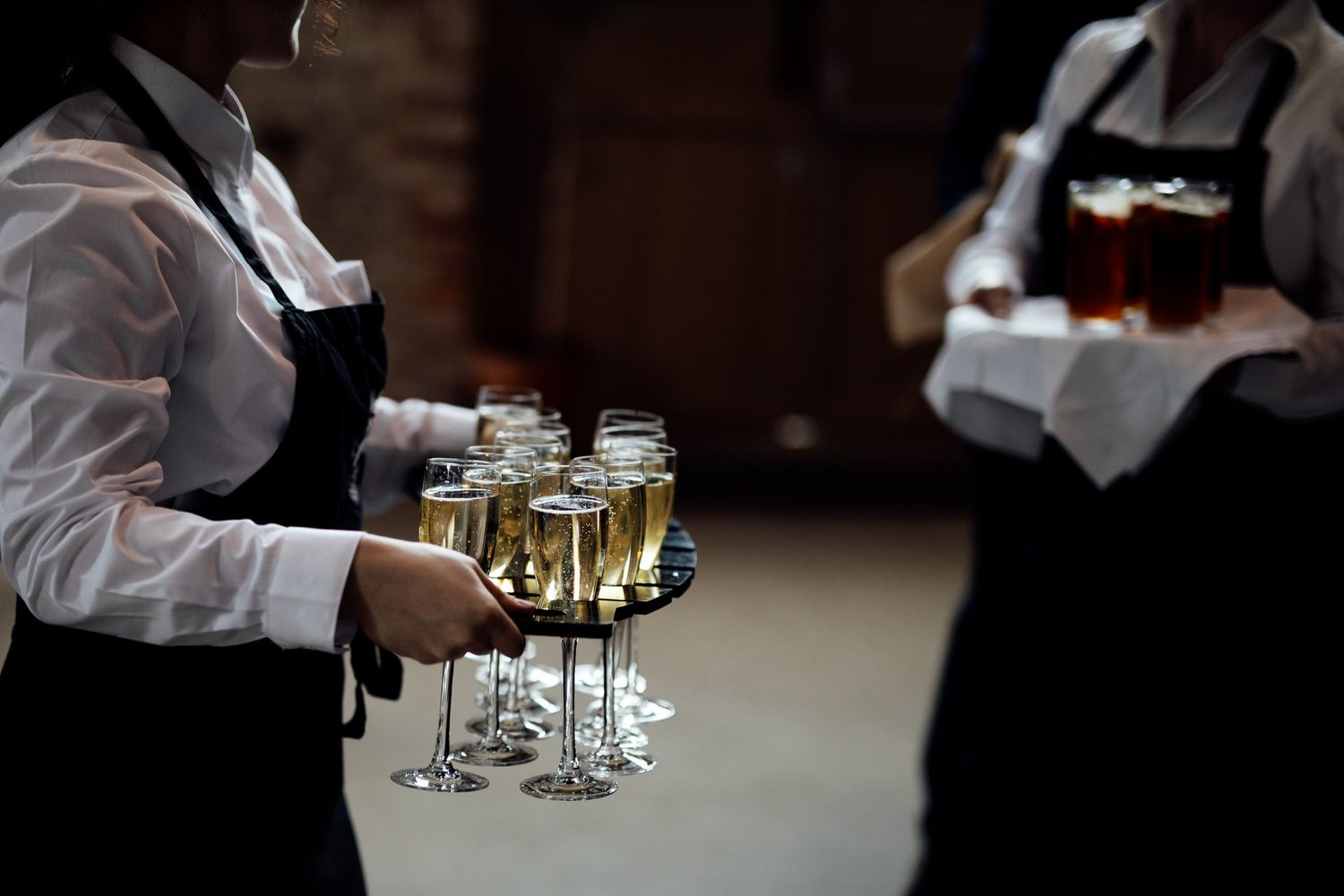 Wedding reception drinks being served in elegant glassware.