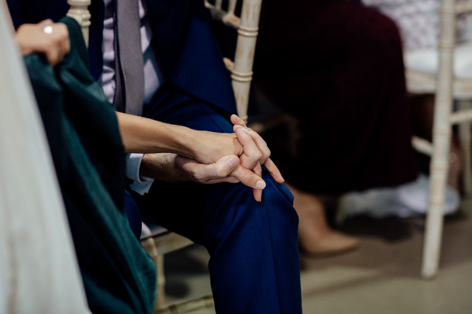 Guests mingle and socialize at a formal event in an elegant indoor venue.