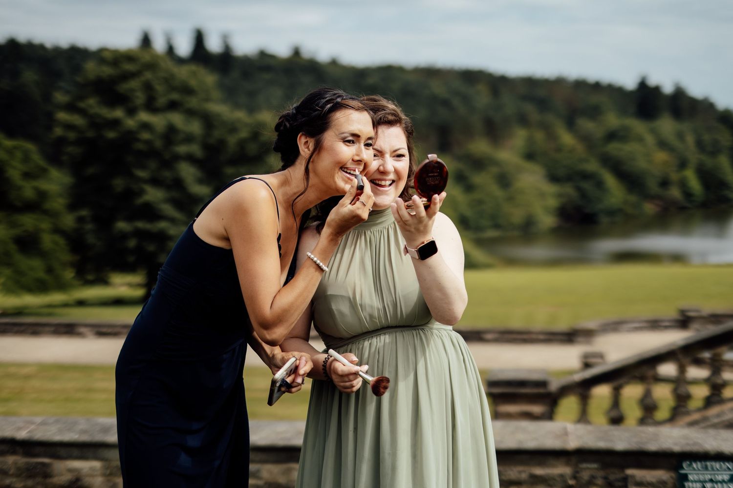 Wedding guests enjoying a scenic outdoor celebration by the water.