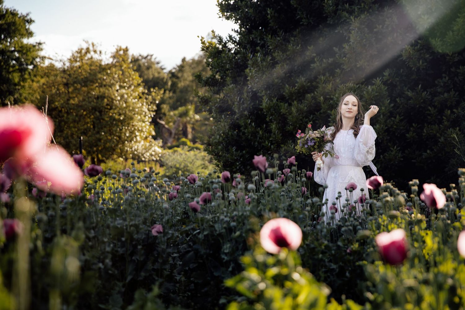 Ethereal garden wedding photography with soft lighting and delicate floral elements.