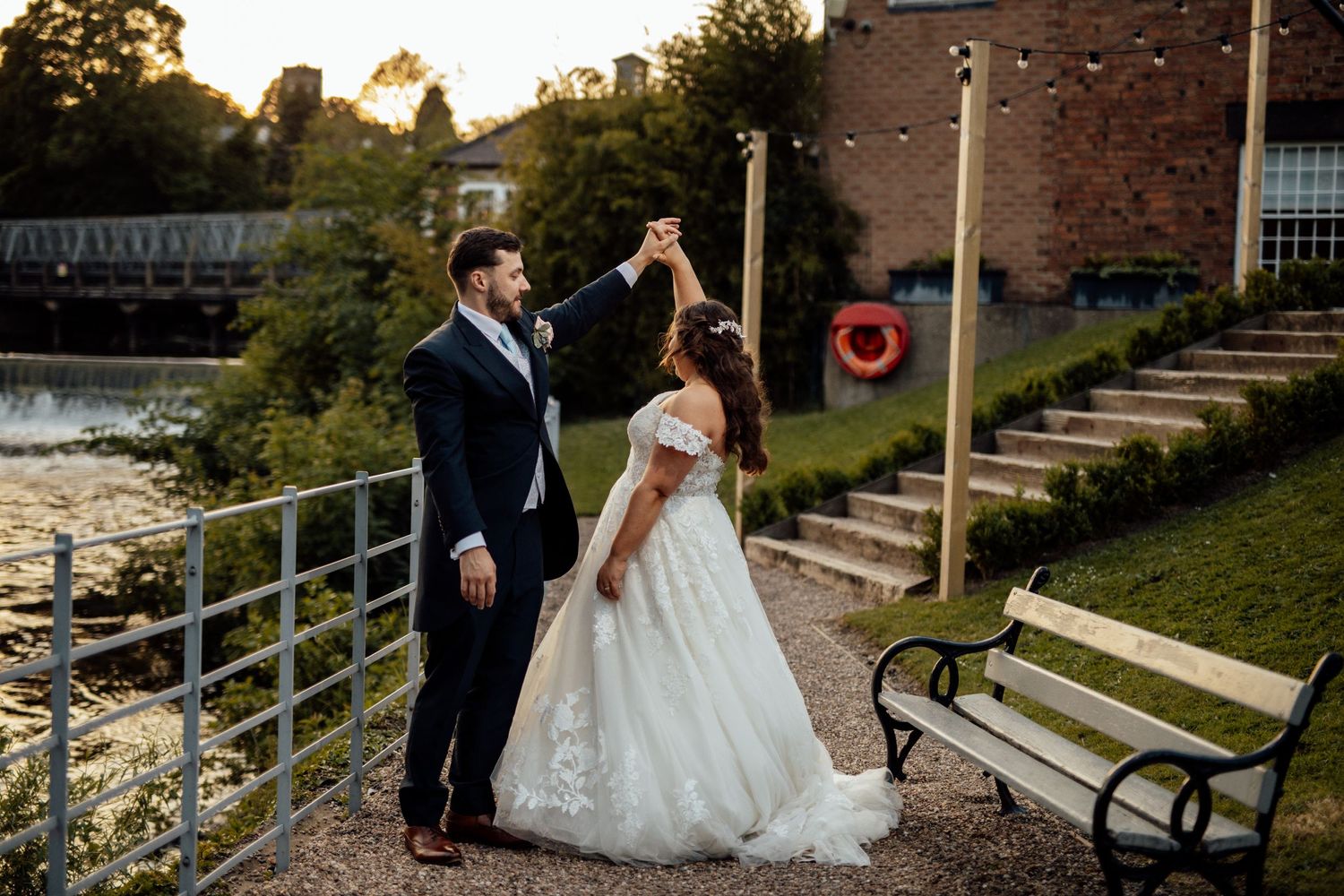 Romantic sunset wedding portraits at a historic waterfront venue.